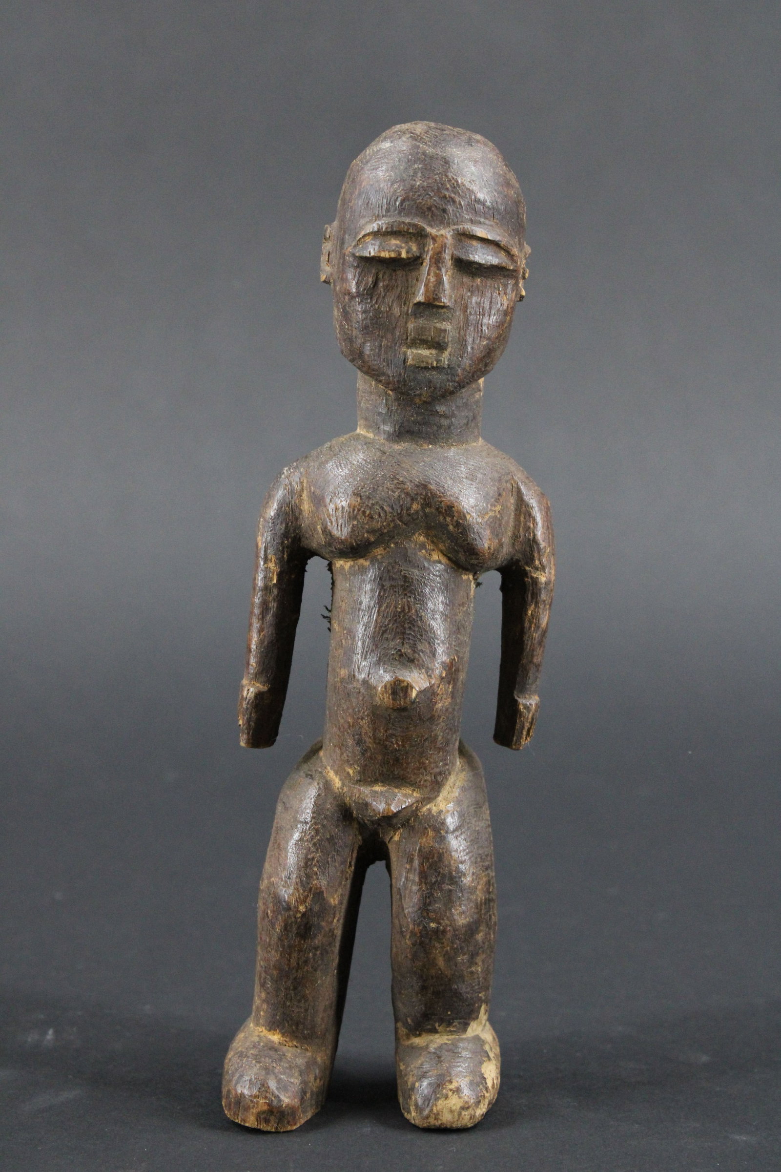 Lobi People, Figural Carved Wood Fetish: Lobi People Figural Carved Wood Fetish. African. Size: 7.25"H x 2"W x 2"D