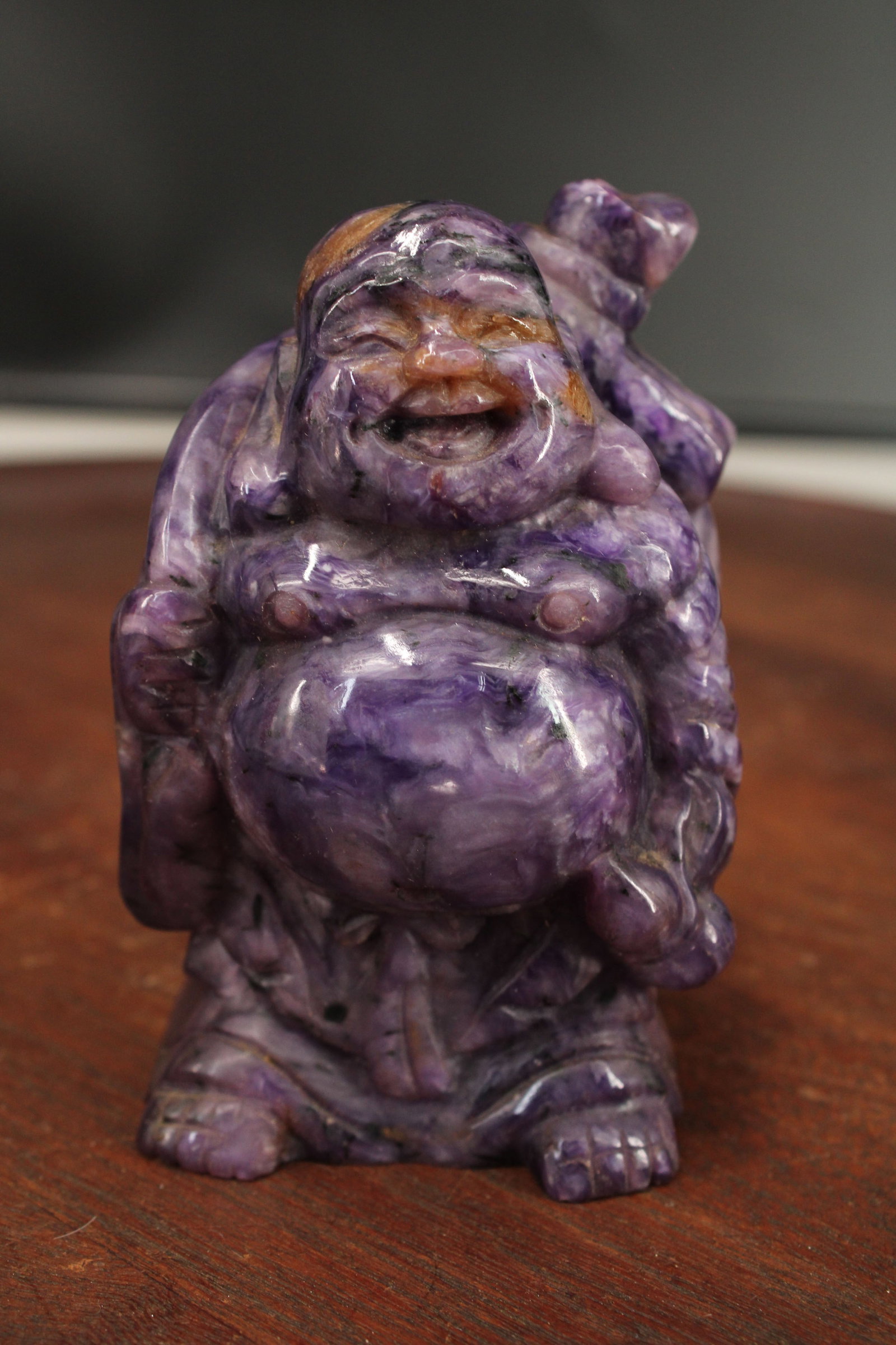 Carved Amethyst Laughing Maitreya Buddha: Amethyst Laughing Maitreya Buddha. Size: 4"H x 2.5"W x 2.5"D