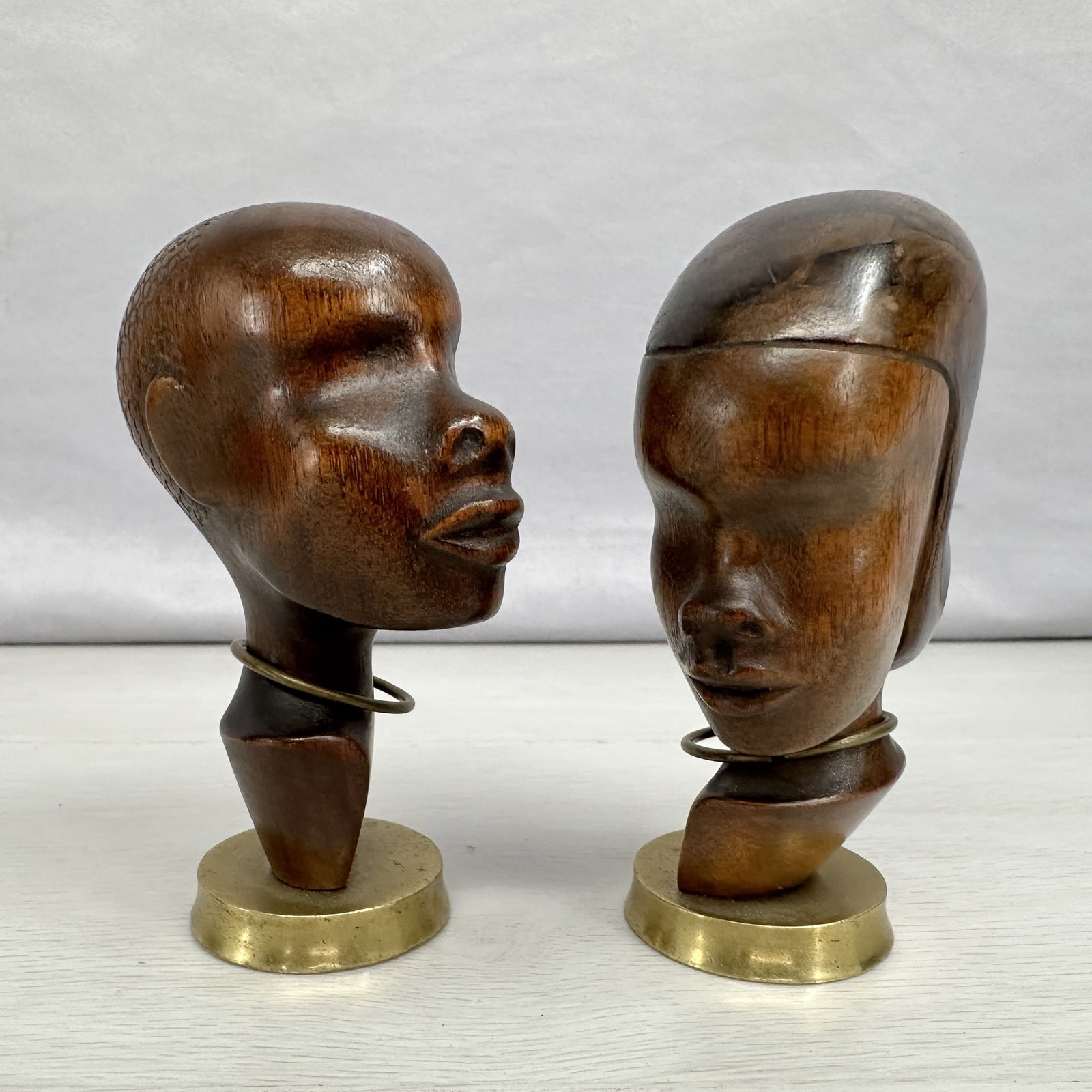 Hagenauer Carved Wood Heads: Miniature carved wood busts with brass details by Karl Hagenauer, Austrian artist, signed underneath. Size: 4.25"T
