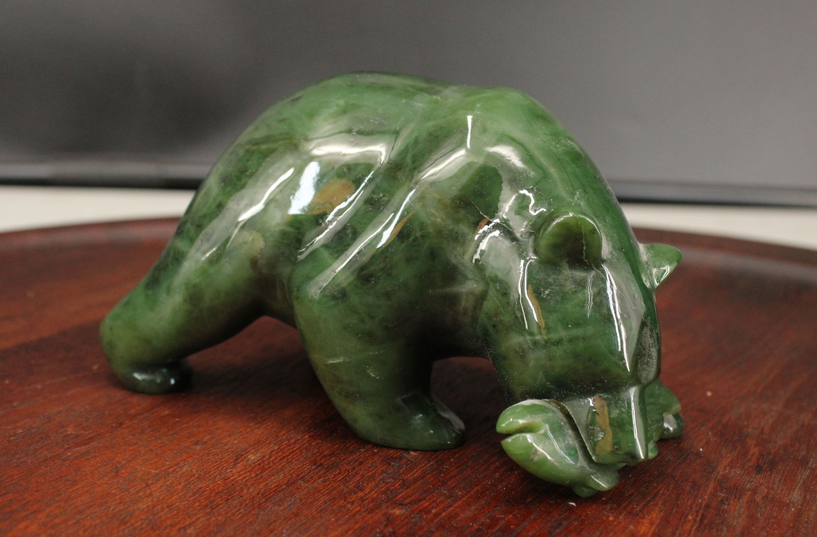 Pacific Northwest Coast Carved Jadeite Bear: Pacific Northwest Coast Carved Jadeite Bear. Signed. Size: 3.25"H x 5.75"W x 3'D