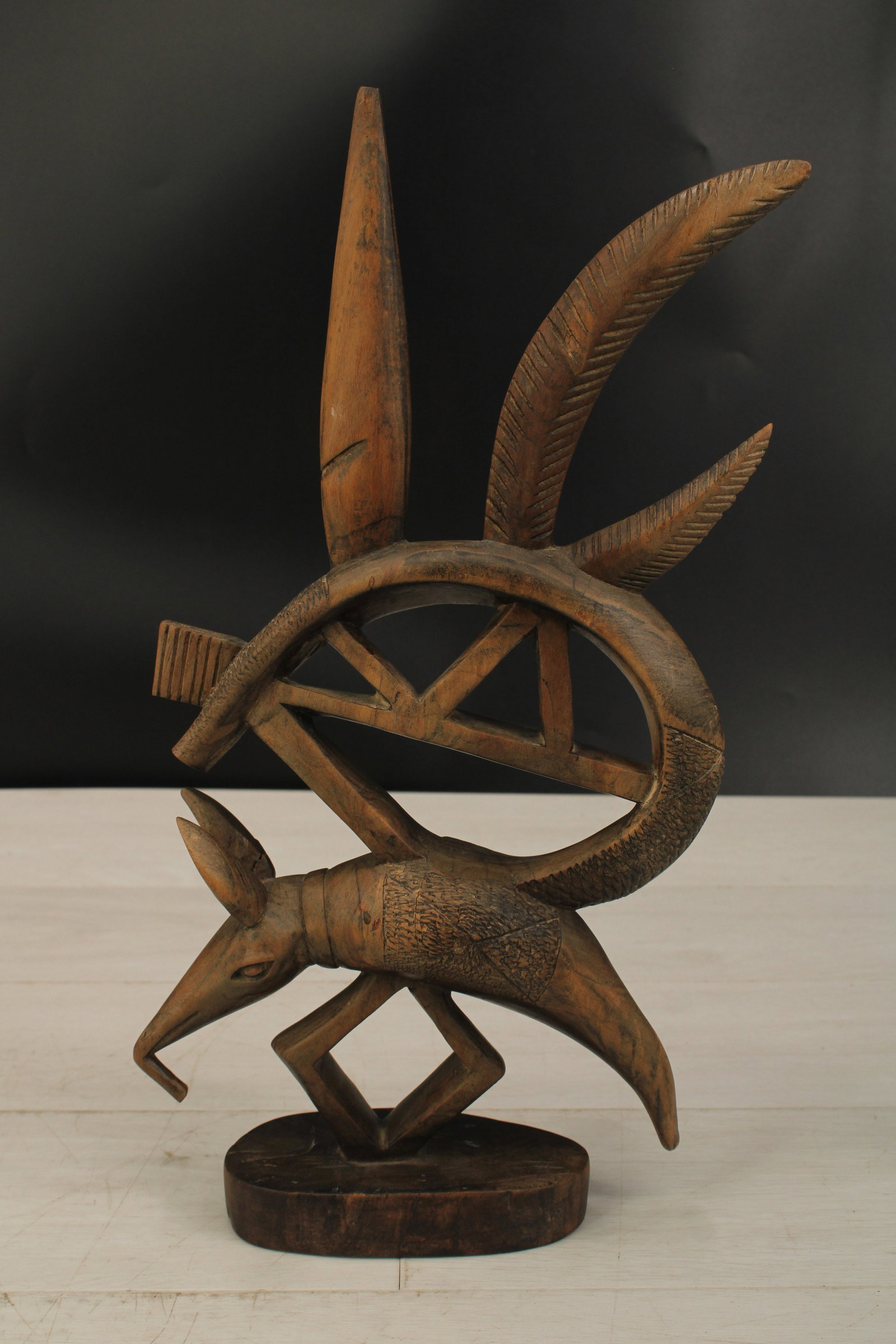 Chiwara Antelope Headdress: Carved wood Bamana Chiwara antelope headdress, Mali. Dance and ceremonial use. Size: 17" x 10" x 3"