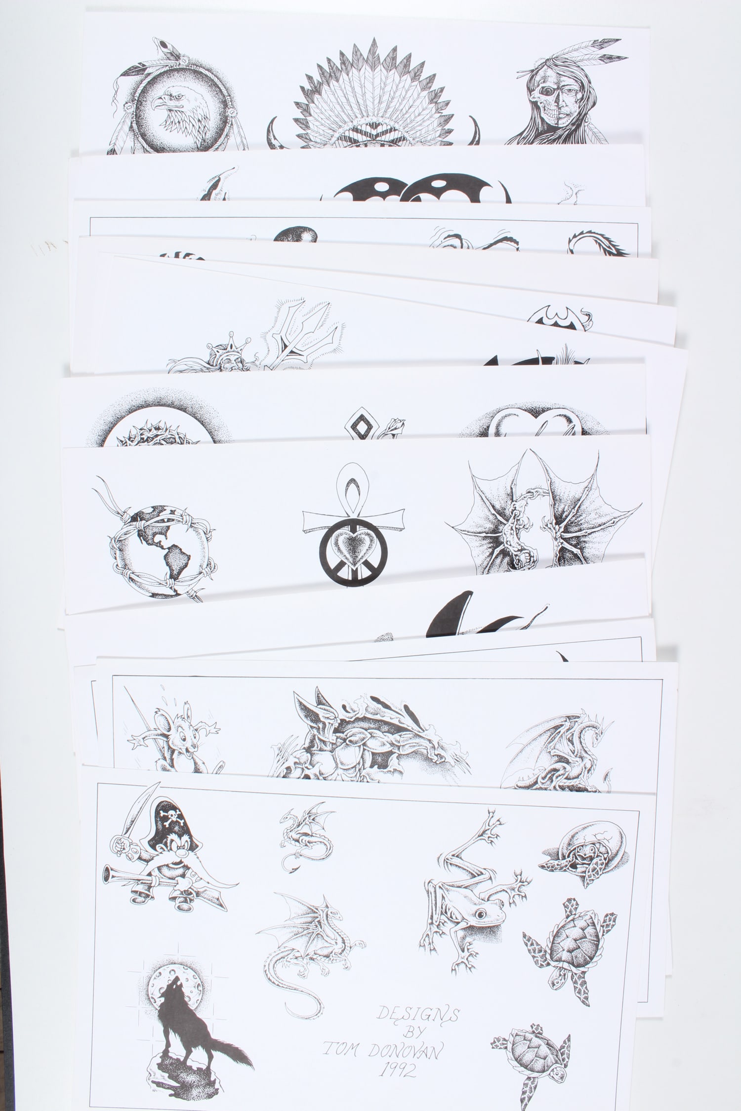 Tom Donovan Tattoo Flash - 14 Sheets: Tom Donovan Tattoo Flash - 14 Sheets. 1989, 1991 and 1992. 73 images. Celestial, hearts, music, religious, cartoons, symbols, etc. Size: 11" H x 17" W