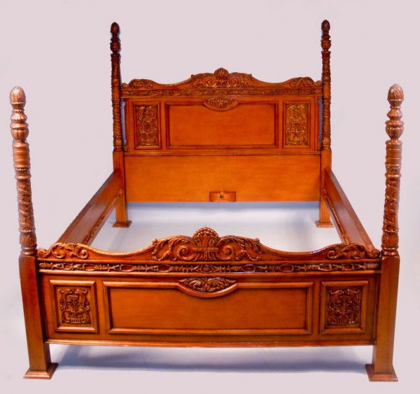European Carved Fruitwood Bedroom Suite: A finely carved European four piece fruitwood bedroom suite, consisting of a poster bed (62"h x 65 1/8"w0, tall chest (37"w x 73 1/4"h x 17 3/4"d), and two bedside stands ( each 19 1/2"w x 14"d x 39 1
