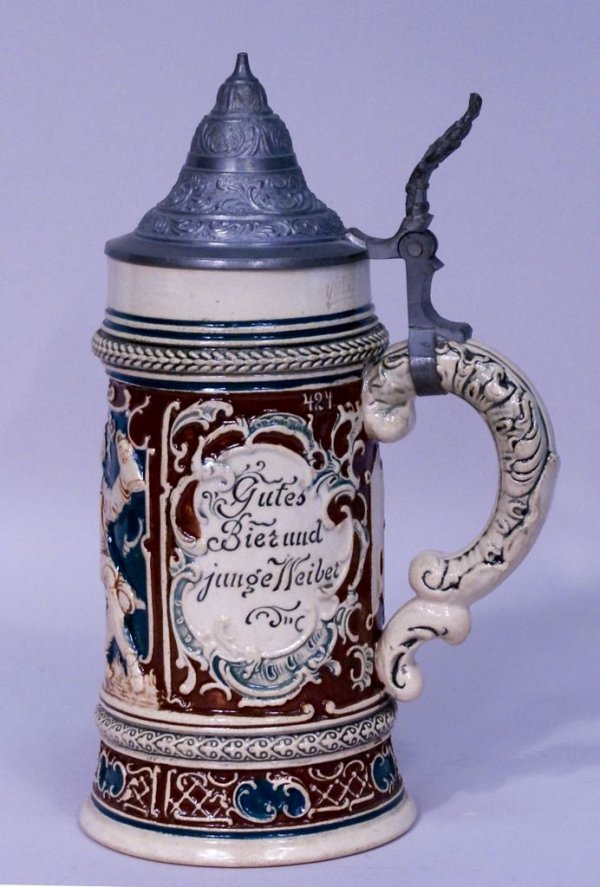 c1900 German Stoneware Lidded Stein: A 9 1/2"h Mettlach style German stoneware 1/2 liter stein with pewter lid, impressed "424 Germany".
