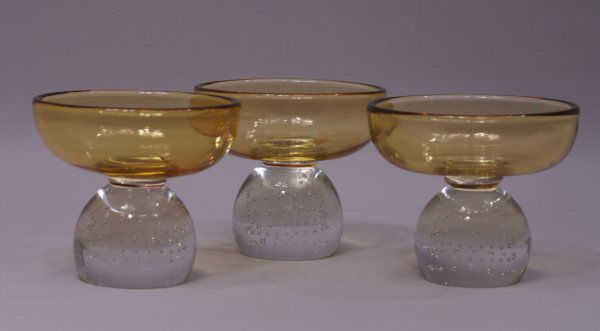 Set/3 Pairpoint Art Glass Controlled Bubble Ball Compor: A set of three Erickson Pairpoint hand blown comports of pale amber crystal with clear controlled bubble-ball stems, each 5"w x 4 1/4"h.