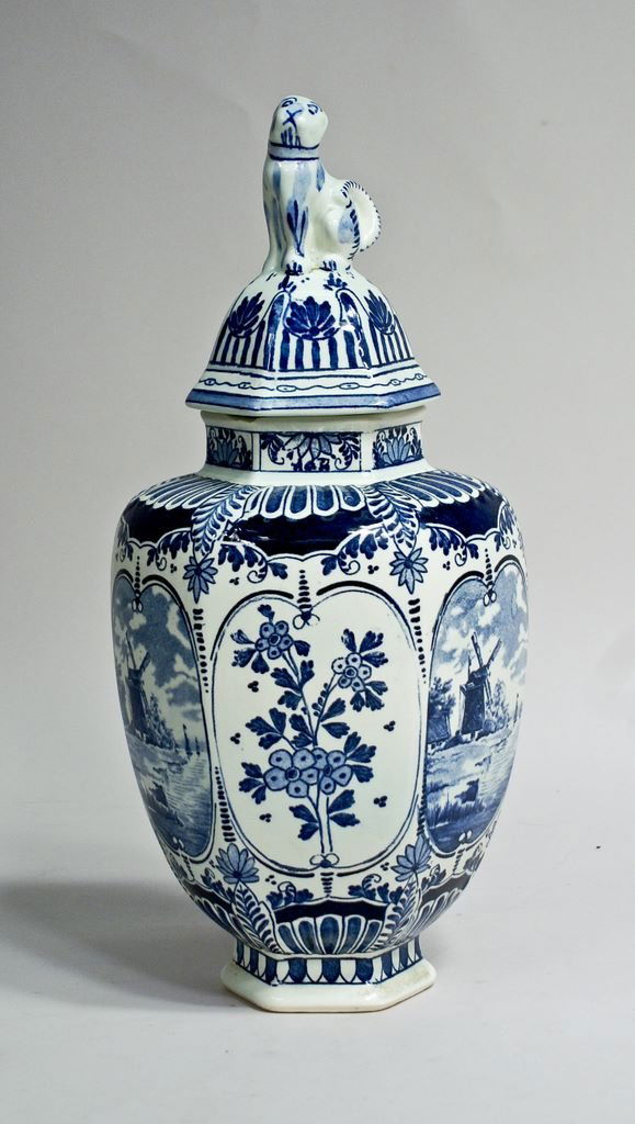 Boch Delfts Blue & White Faience Ginger Jar: A 14"h Boch Delfts faience blue & white transferware ginger jar made for Royal Sphinx. Of hexagonal form, decorated with alternating floral panels and Dutch landscape scenes. The rim of the base has a