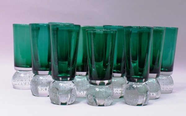 Set/12 Pairpoint Art Glass Controlled Bubble Ball Tumbl: A rare set of twelve Erickson Pairpoint hand blown 7 3/4"h tumblers of deep emerald green crystal with clear controlled bubble-ball stems.