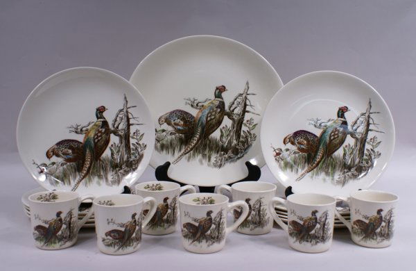 18pc Set of Johnson Brothers "Pheasant" Game Birds Chin: A eighteen piece set of Johnson Brothers "Pheasant" Game Birds china, comprised of ten 11 1/4" plates, seven 3 3/8"h mugs, and a 14 3/4" platter. Small nick to one mug, two mugs have darkened interior