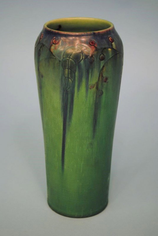 Rookwood Pottery Vase by Charles S. Todd: A dated 1919 Rookwood Pottery Arts & Crafts 9 1/2"h matte green vase with incised decoration of draping foliage and berries, burgundy and blue blended highlights. "C.S.T." incised signature, #2039D. T