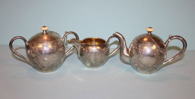 Three Piece Russian Silver Miniature Tea Set, Smirnov, : Three Piece Russian Gilded Silver Miniature Tea Set., Smirnov, Moscow 1884; small tea pot with lid, bone handle, covered sugar, creamer. All etched, gold washed; Russian Marks