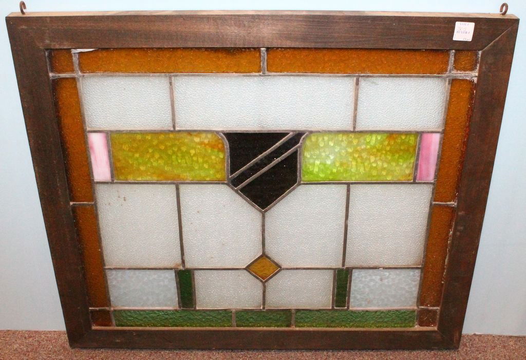 English Antique Stain Glass Window with Shield Design: English antique stain glass window with shield design; 27" w., 23 1/2" h.