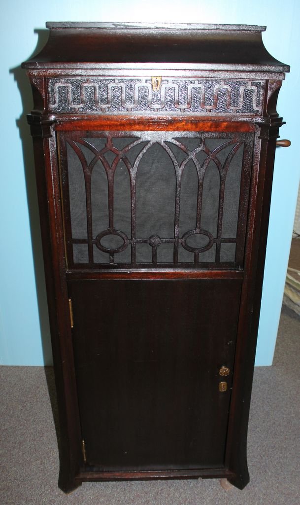 Edison 1917 Diamond Disc Phonograph: Edison 1917 Diamond Disc (thick records) phonograph. There are two doors which open to reveal two slide out drawers. Has the original book with it, and works well; 20 1/2" w., 22" d., 51" h.0