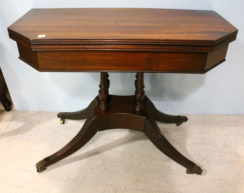 Carved Mahogany Duncan Phyfe Style Card Table: Carved mahogany Duncan Phyfe style card table with brass paw feet and brass coasters; 37''w., 18''d., 30''h.