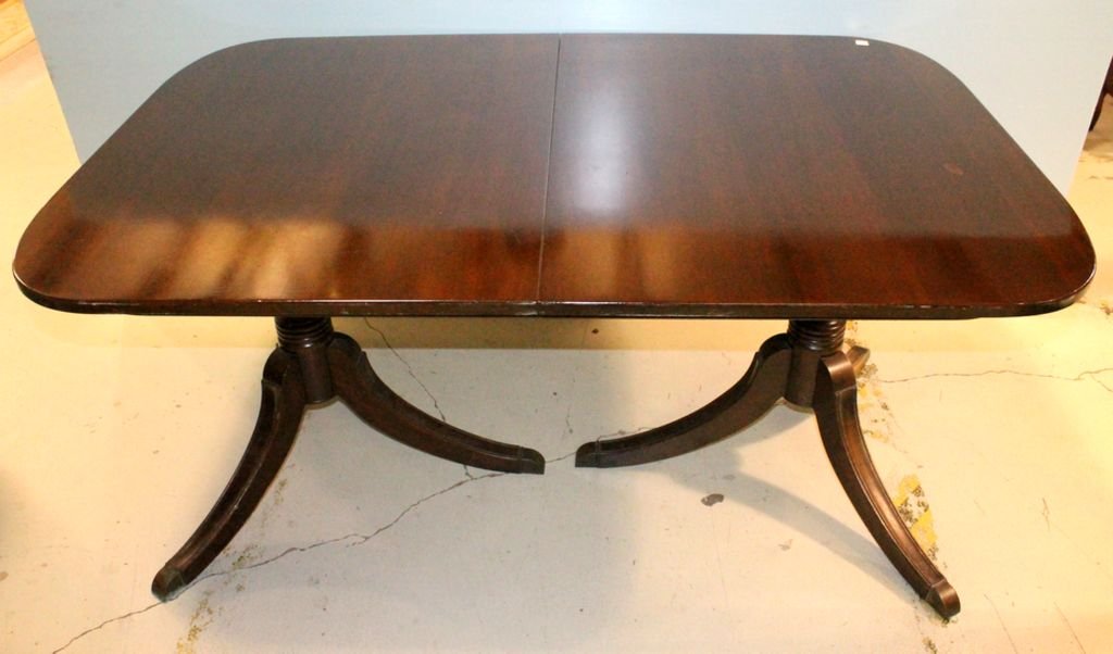 Mahogany Duncan Phyfe Style Dining Table: Mahogany Duncan Phyfe style dining table, two pedestal, feet with brass caps, three leaves; 62" w., 42 1/2" d. 29" h.