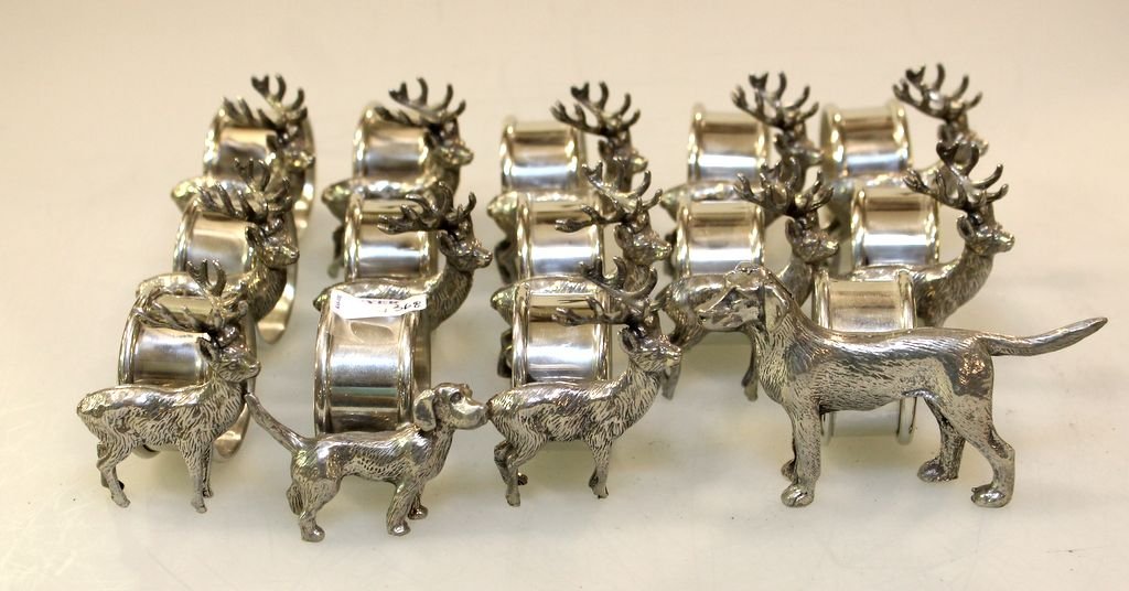Fourteen Silverplate Figural Napkin Rings: Fourteen silverplate figural napkin rings, two dogs and twelve deer.