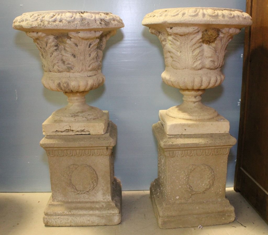 Pair of Grecian Concrete Urns: Pair of Grecian concrete urns on square base.; 18" dia., 36" h.