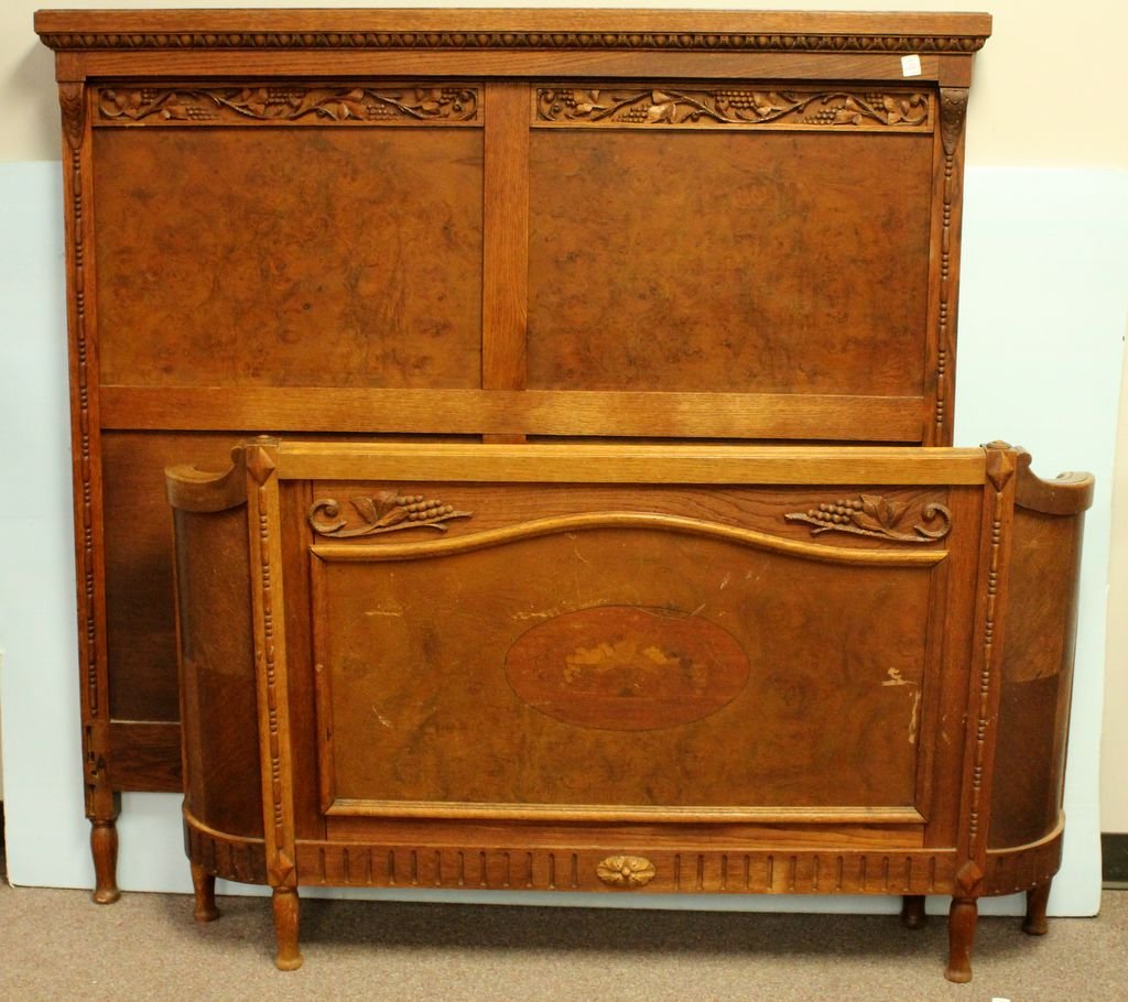 Standard Size Walnut Curved Footboard Bed: Standard size walnut bed with egg and dart carving over grape leaf carving with rounded footboard.; 57" h.