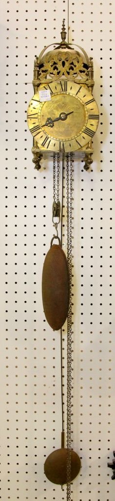 Antique French Wall Clock: Antique French brass weight driven wall clock. 6 1/2" w., 15 1/2" h.