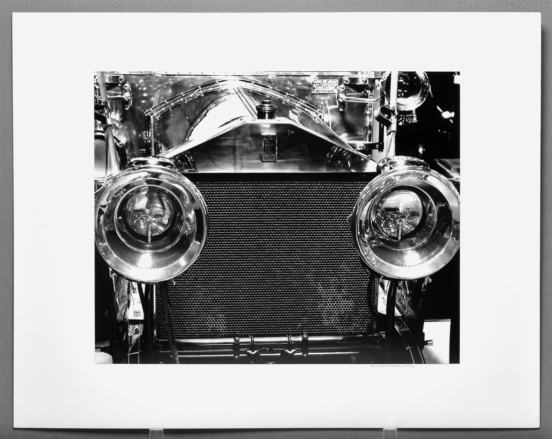 Robert Byers (1918-2021) Signed 1977 Rolls Royce - Sparks Nevada 15"x19" Photograph: Gelatin silver photograph Signed and dated under the image with photographer's label on the back as shown Taken in 1977, printed in 1991, darkroom made, mounted on 22"x28" museum board This photograph