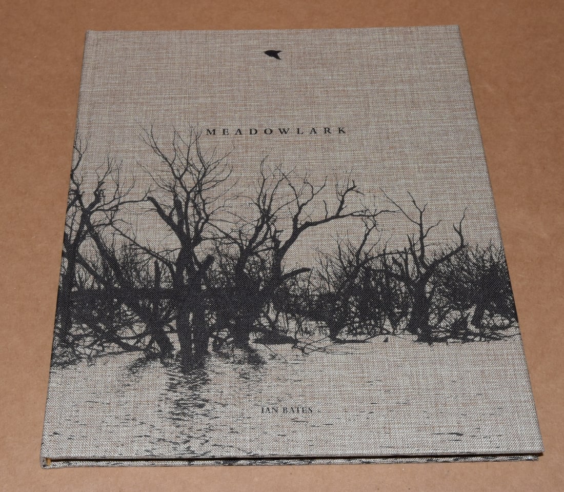 Ian Bates (1992 - ) Signed Meadowlark First Edition 2022 - Deadbeat Club - Hardcover: Signed Hardcover 96 Pages -Full Color Offset 9.5”x11.5” To make the pictures in Meadowlark, Ian Bates spent years driving the vast, sparsely-populated spaces of the American West, often sl