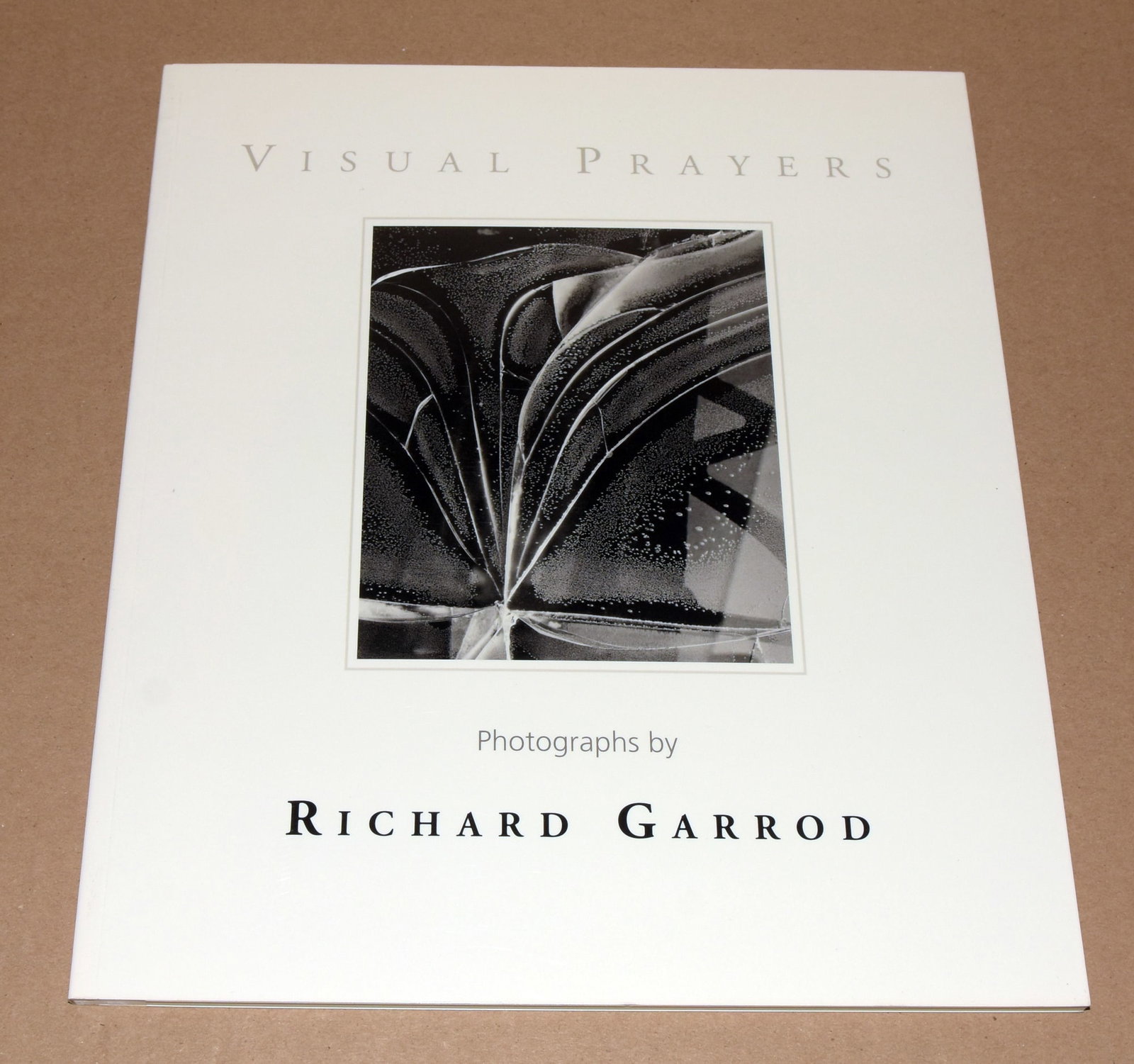 Richard Garrod (1924 - 2022) Signed 2001 Visual Prayers - Softcover: Signed First Edition Softcover. 64 pages. Features an essay by Mary Murray. Includes numerous black and white images and a chronology. French style wrappers. Signed by Garrod on the title page. Richar
