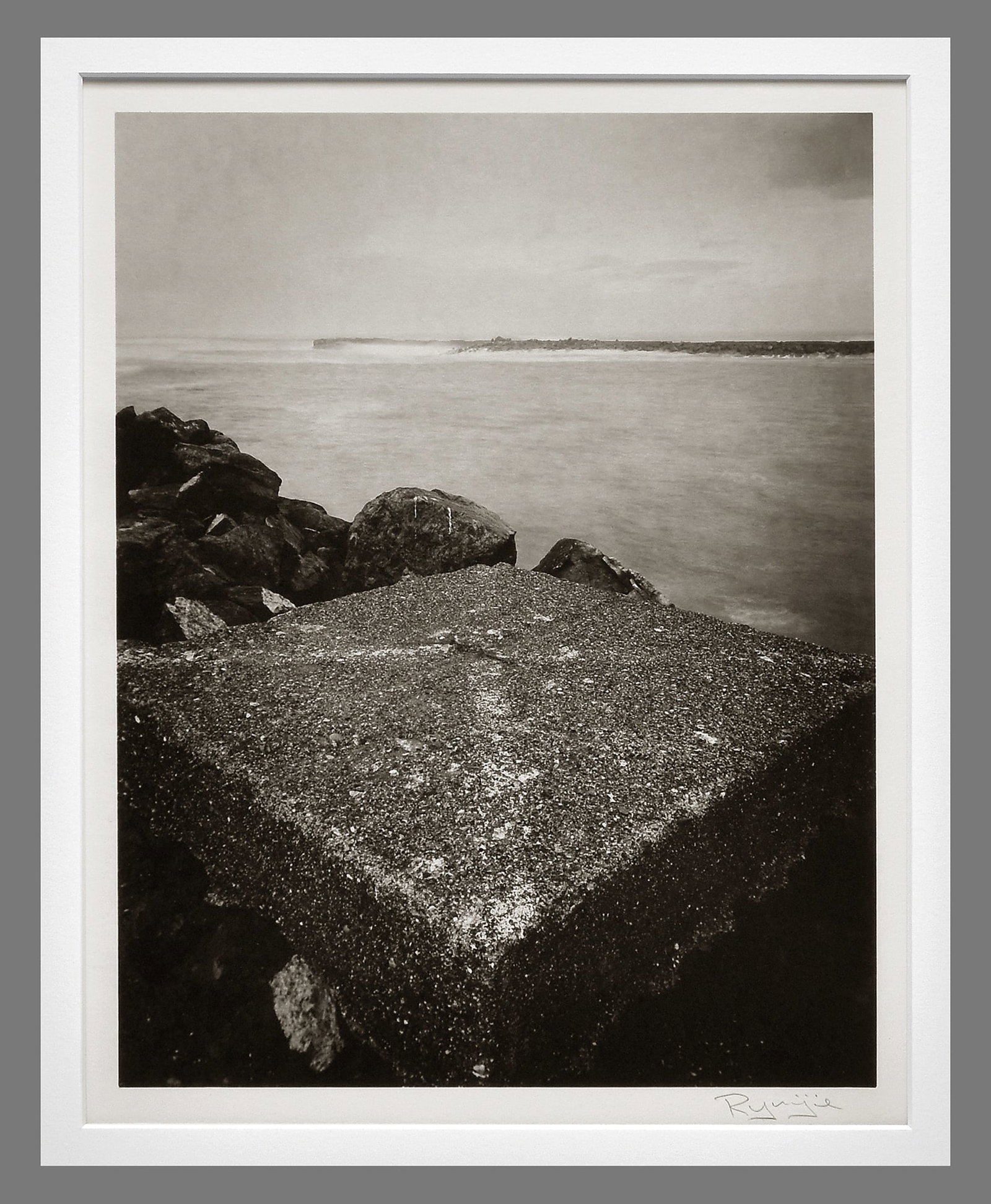 Ryuijie (1950 - ) Signed 2001 Breakwater & Storm 11"x8.5" Oversized Platinum Photograph: Platinum photograph Signed under the image with photographer's information below the image, under the mat Corner mounted and matted with 16"x20" museum board Ryuijie (b. 1950, Otaru, Japan) moved to t