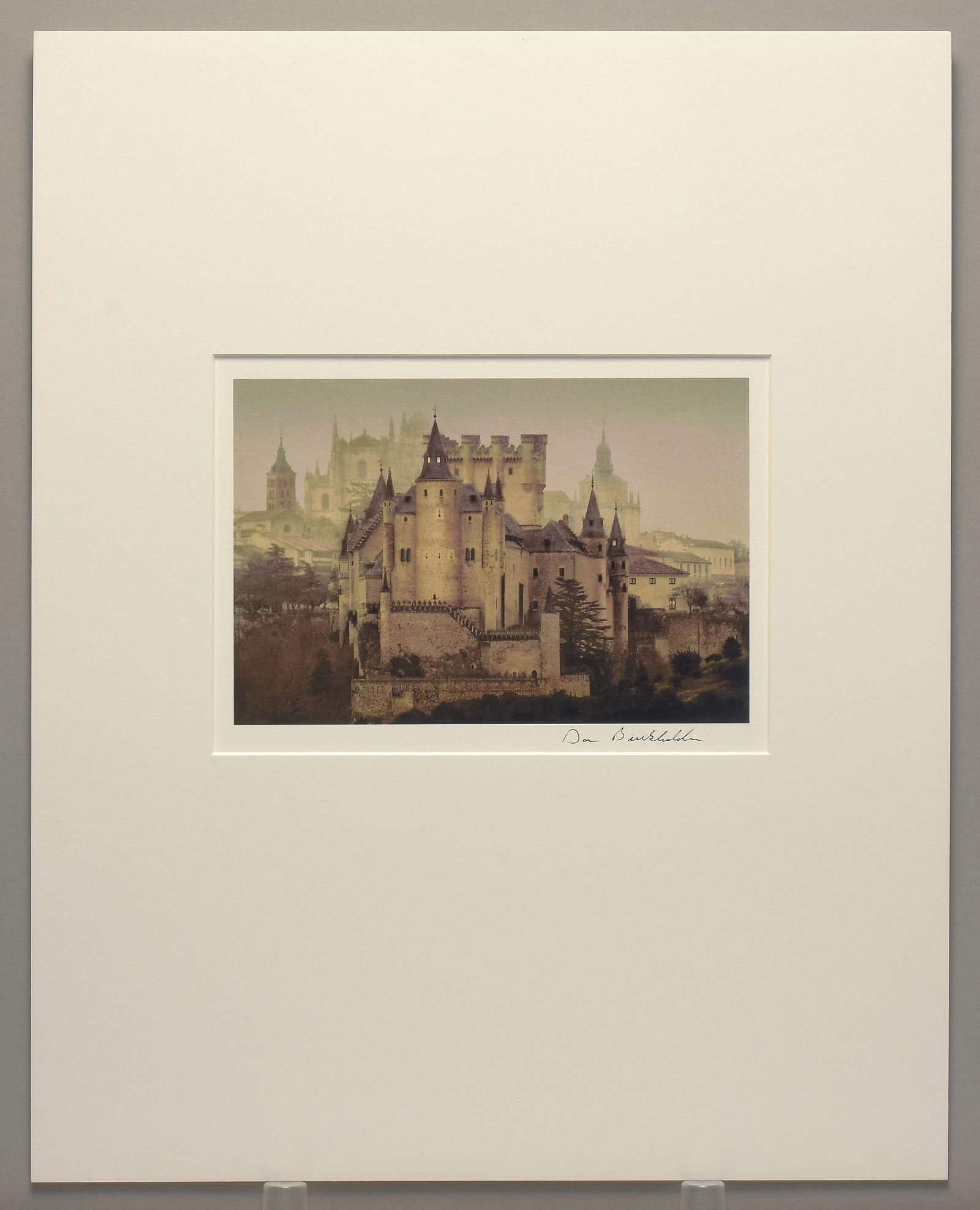 Dan Burkholder (1950-) Signed 2002 Castle - Segovia, Spain 6"x9" Photograph: Experience the timeless beauty of Spain through the lens of Dan Burkholder Archival pigment photograph Signed under the image Matted with 16"x20" museum board Dan Burkholder is a seminal figure in con