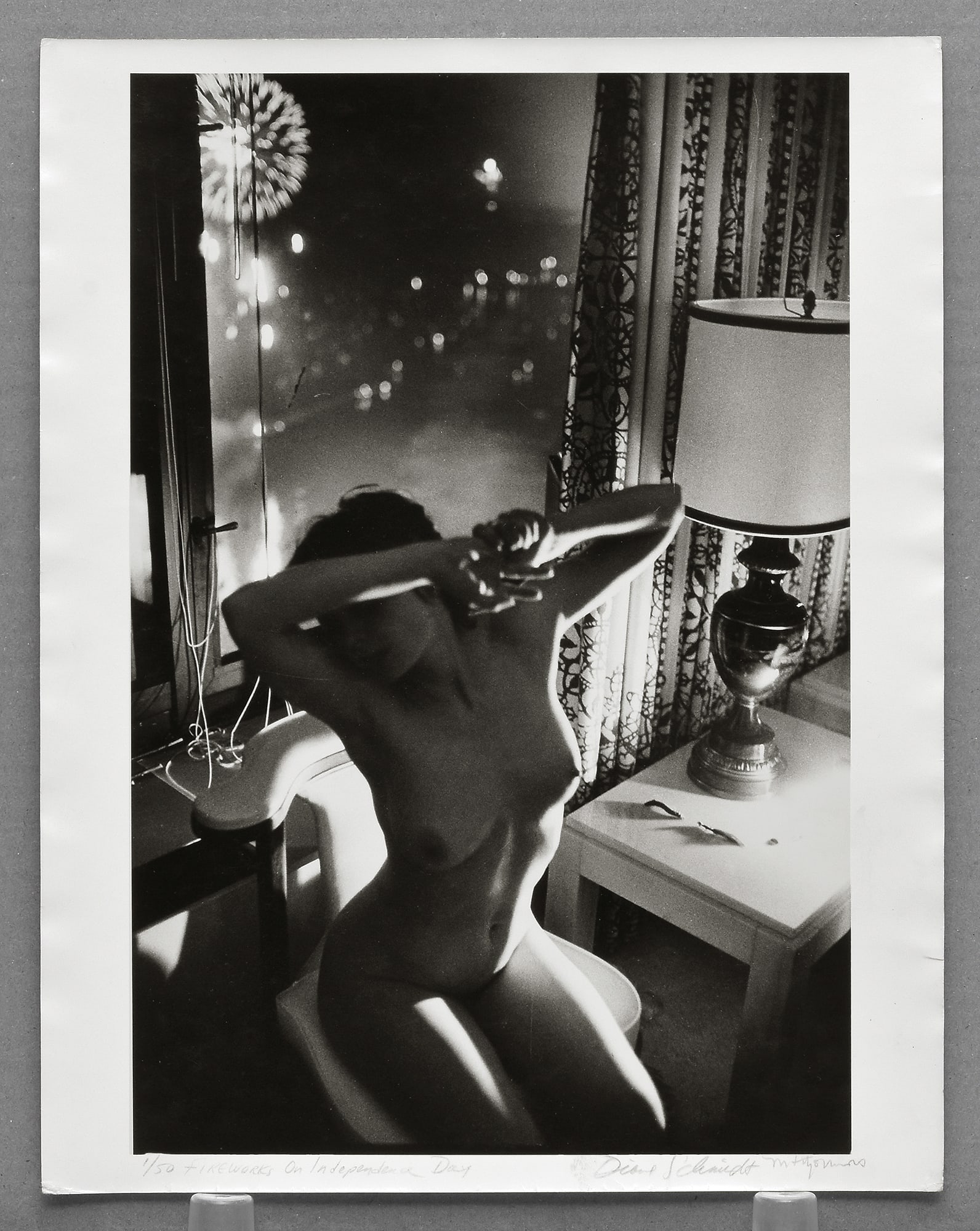 Diane Schmidt - Fourth of July 13"x8.5" Photograph - Signed by both Schmidt & Fitzsimmons (Model): Rare vintage gelatin silver photograph from Diane Schmidt’s celebrated The Chicago Exhibition series (1979–1984), exploring the relationship between the human form and the urban landscape through 