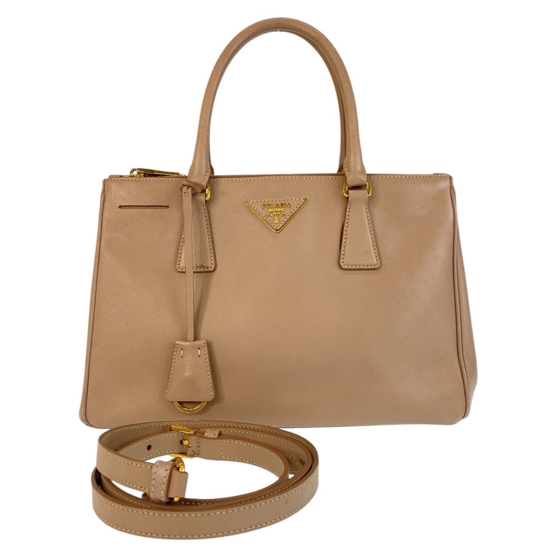 Prada Handbag Leather Beige Gold Metal Handbag Crossbody Shoulder Bag 2Way Safiano Galleria: Material: Leather Gender: Women Pattern: Safiano Brand: PRADA Item: Handbag Model: Galleria TriangleWith logo Line: Safiano Type: Handbag Crossbody Shoulder Bag 2way Gender: Women Color: Beige Gold Me
