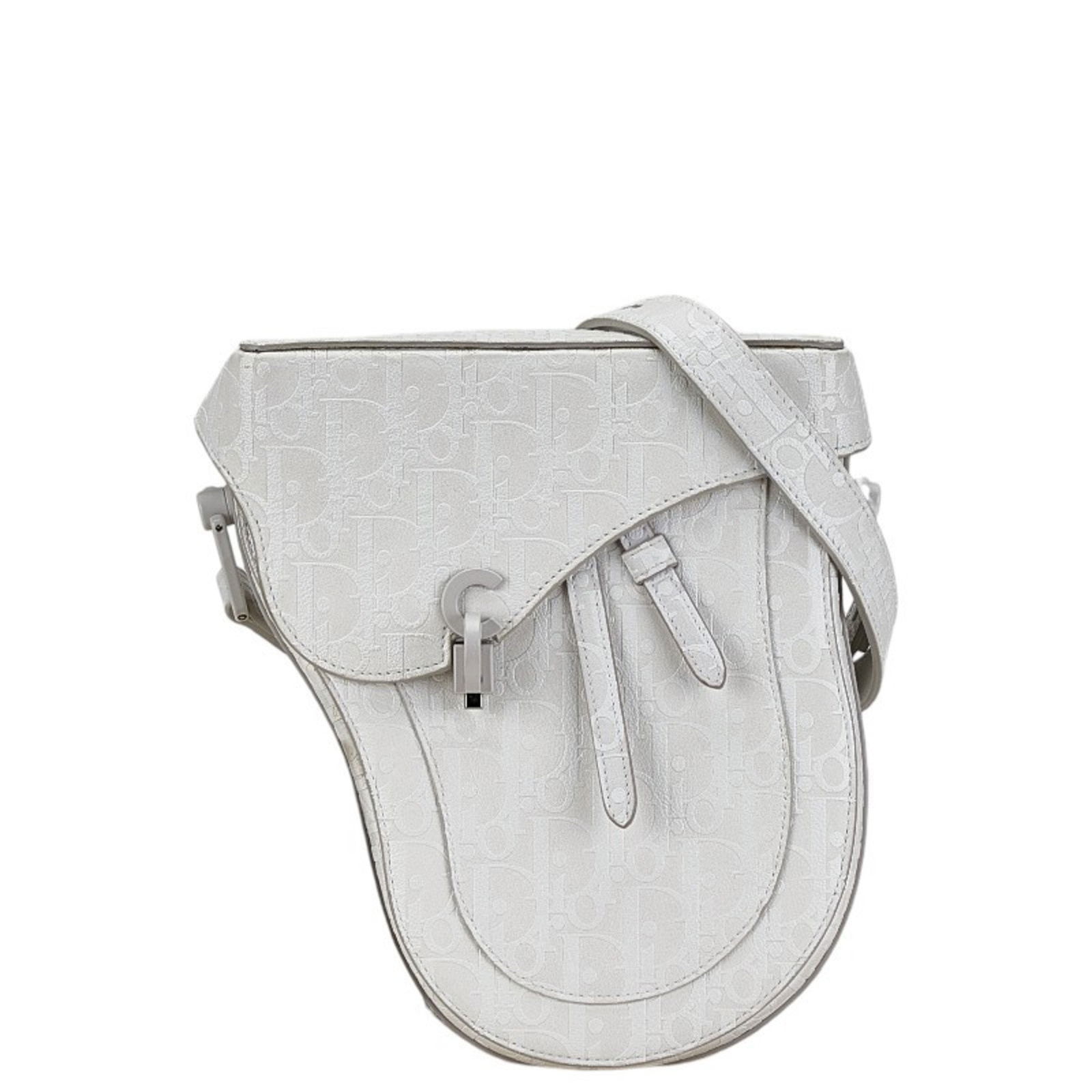 Christian Dior Dior Oblique Saddle Bag: Brand: Christian Dior Type: Saddle Bag, Shoulder Bag Material: Leather Color: White Closure: Magnet Gender: Women Size (Hxwxd): 22cm x 13.5cm x 5.5cm / 8.66'' x 5.31'' x 2.16'' Strap Drop: 54cm / 21.2
