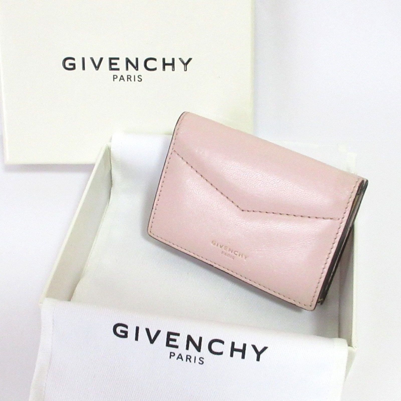 Givenchy Leather Compact Wallet: Brand: Givenchy Type: Wallet (Tri-Fold) Gender: Women Color: Orange, Pink Size (Hxwxd): 7cm x 9.5cm x 2.5cm / 2.75'' x 3.74'' x 0.98'' Condition: Used (like new), Hardly any traces of usage nice item