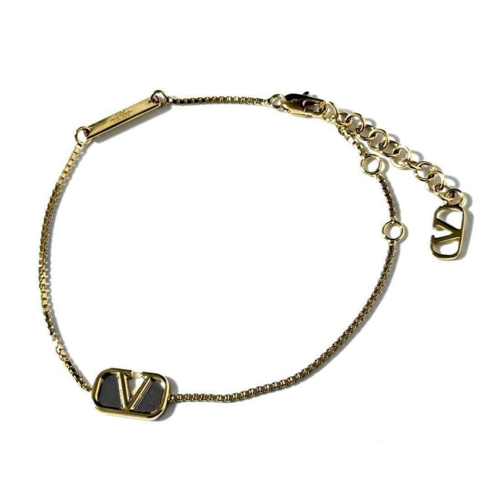 Valentino Varentino Garavani: Brand: Valentino Type: Charm Bracelet Gender: Women Material: Metal Color: Gold Length: 18cm - 21.5cm / 7.08'' - 8.46'' Condition: Used (like new), Mint condition, like new item Product Disclaimer: It