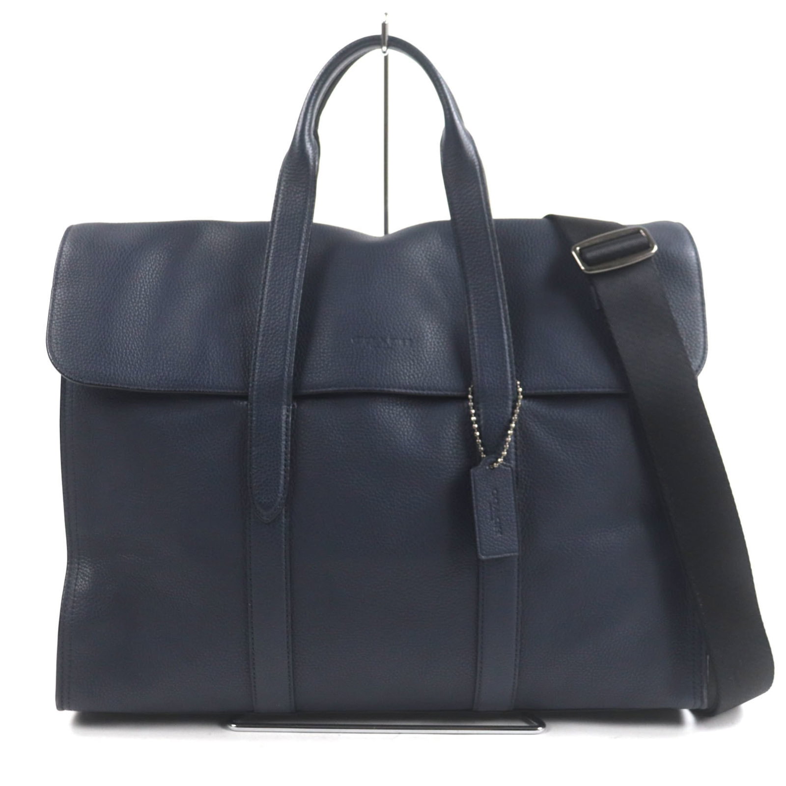 Coach 58097 Metropolitan Portfolio Leather Business Bag/Briefcase With Engraved Logo: Brand: Coach Type: Briefcase Material: Leather Color: Navy Closure: Flap Inner Pocket: Zipper Pocket 1, Open Pocket 3, Pen Holder 1 Outer Pocket: Open Pocket 1 Gender: Men Size (Hxwxd): 32.5cm x 59cm