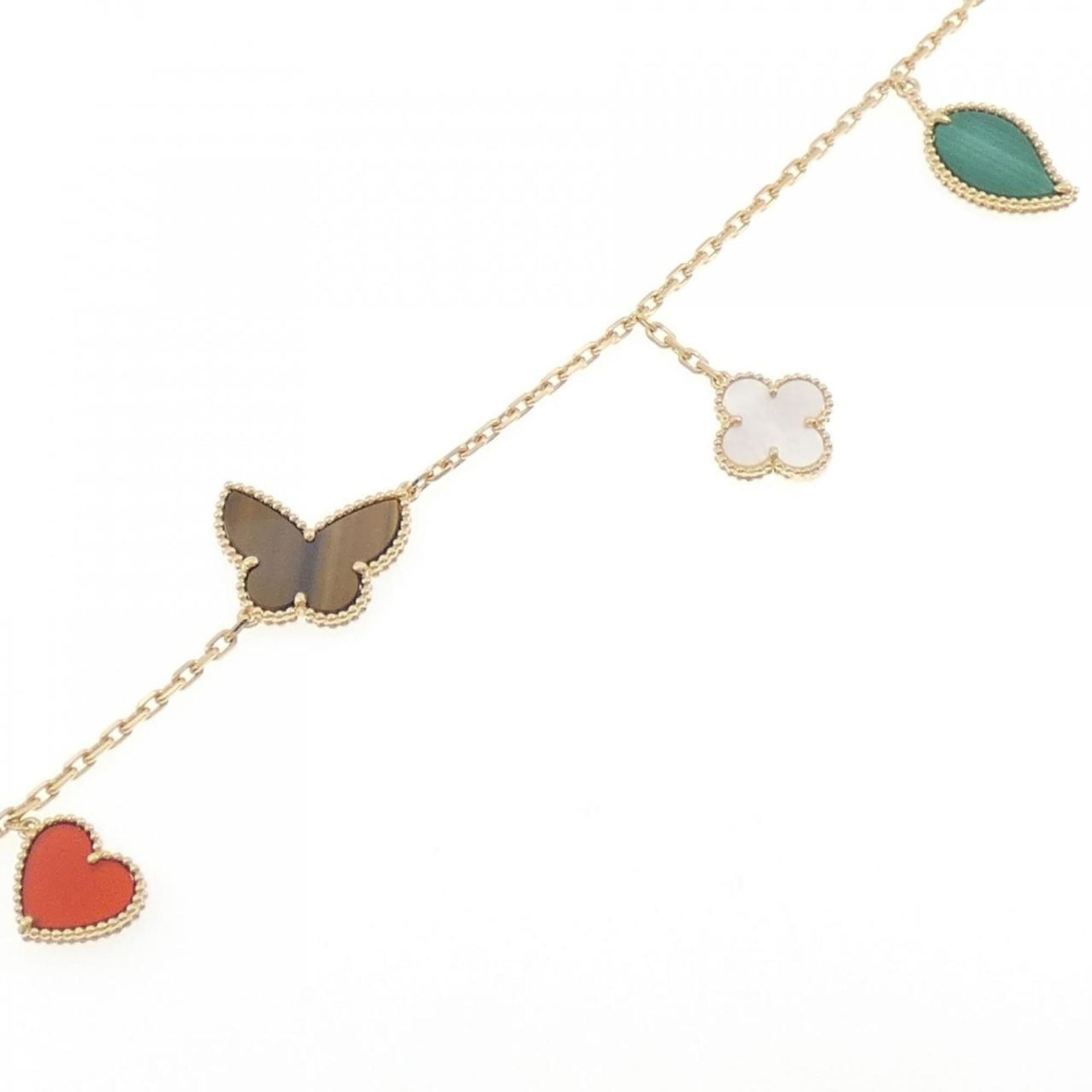 Van Cleef & Arpels Lucky Alhambra Bracelet: Brand: Van Cleef & Arpels Type: Charm Bracelet Gender: Women Material: Yellow Gold (18K) Color: Yellow Gold Stone: Carnelian, Color Stone, Malachite, Tiger'S Eye Length: 19.5cm / 7.67'' Condition: Use