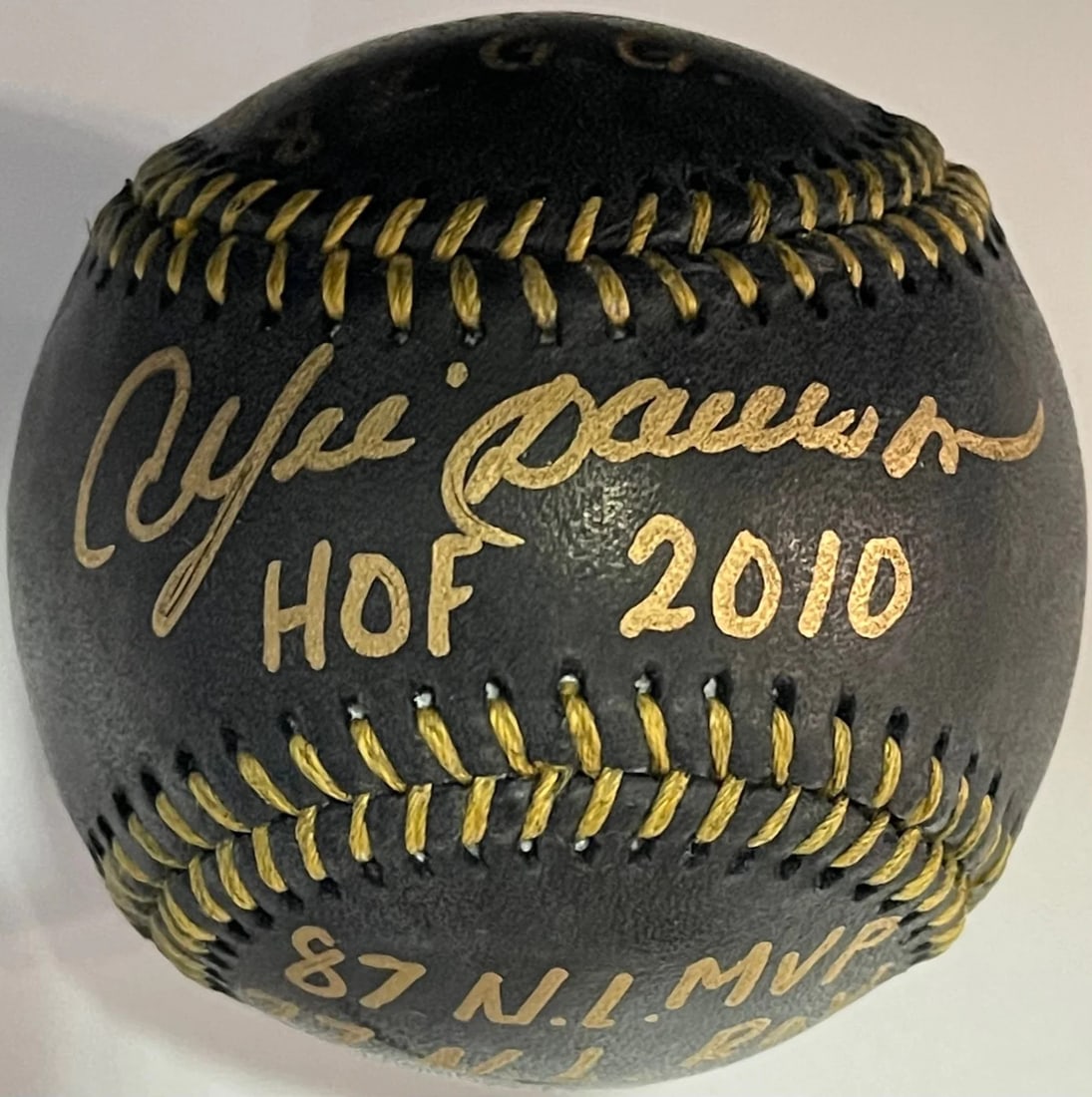 Andre Dawson Autographed Stat Official Black Baseball: Andre Dawson Autographed Stat Official Black Baseball Signed in gold sharpie on a Official Robert Manfred Jr Baseball Stats include "HOF 2010, 8X All Star, 8X G.G, 87 N.L.MVP, 77 N.L.ROY" Product Disc