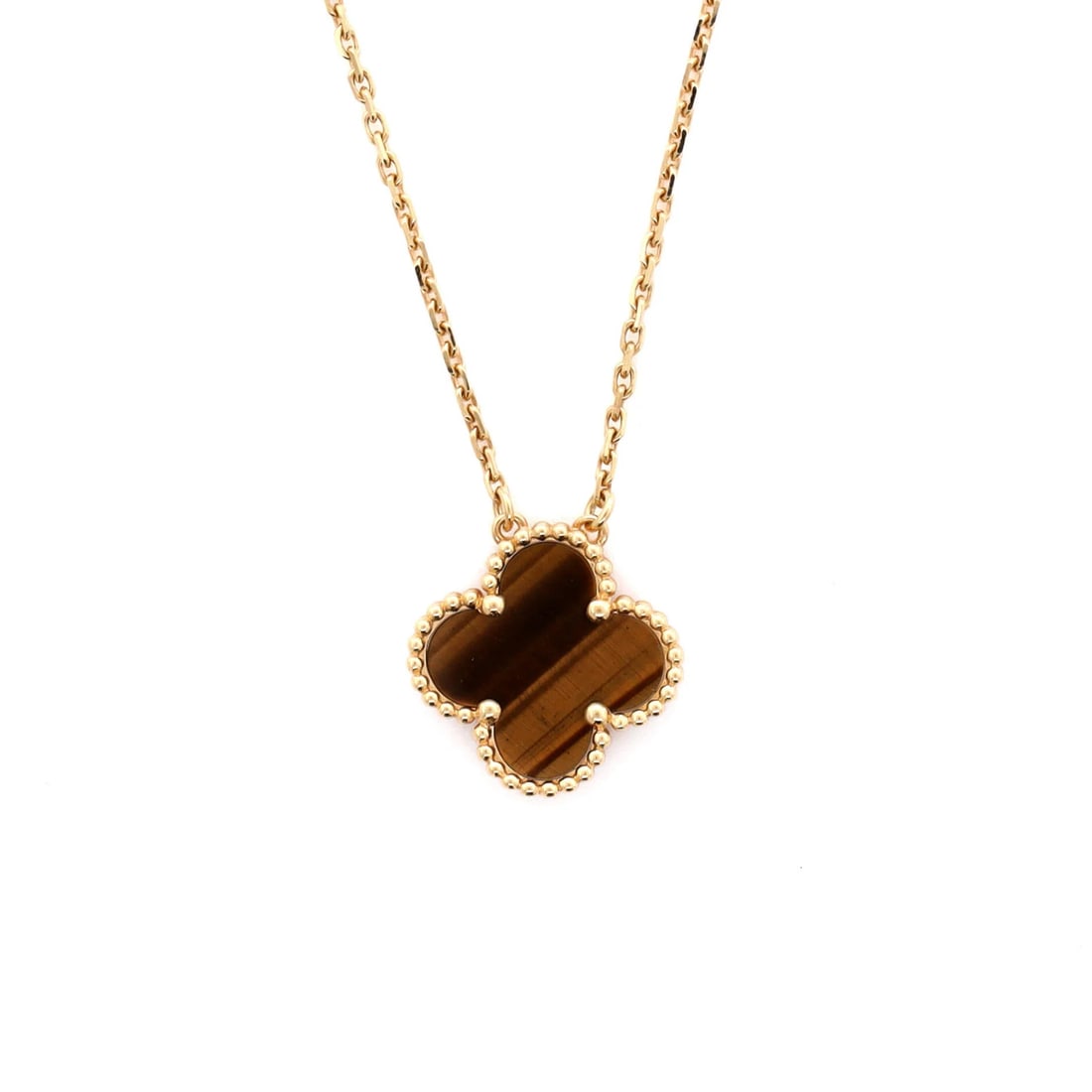 Van Cleef & Arpels Vintage Alhambra Pendant Necklace 18K Yellow Gold And Tiger: Brand: Van Cleef & Arpels Style: Pendant Type: Necklace Color: Yellow Gold Main Stone: Unknown Material: 18K Yellow Gold Tiger Eye Metal: 18K Yellow Gold Metal Purity: 18K Measurements: Length: 16.25