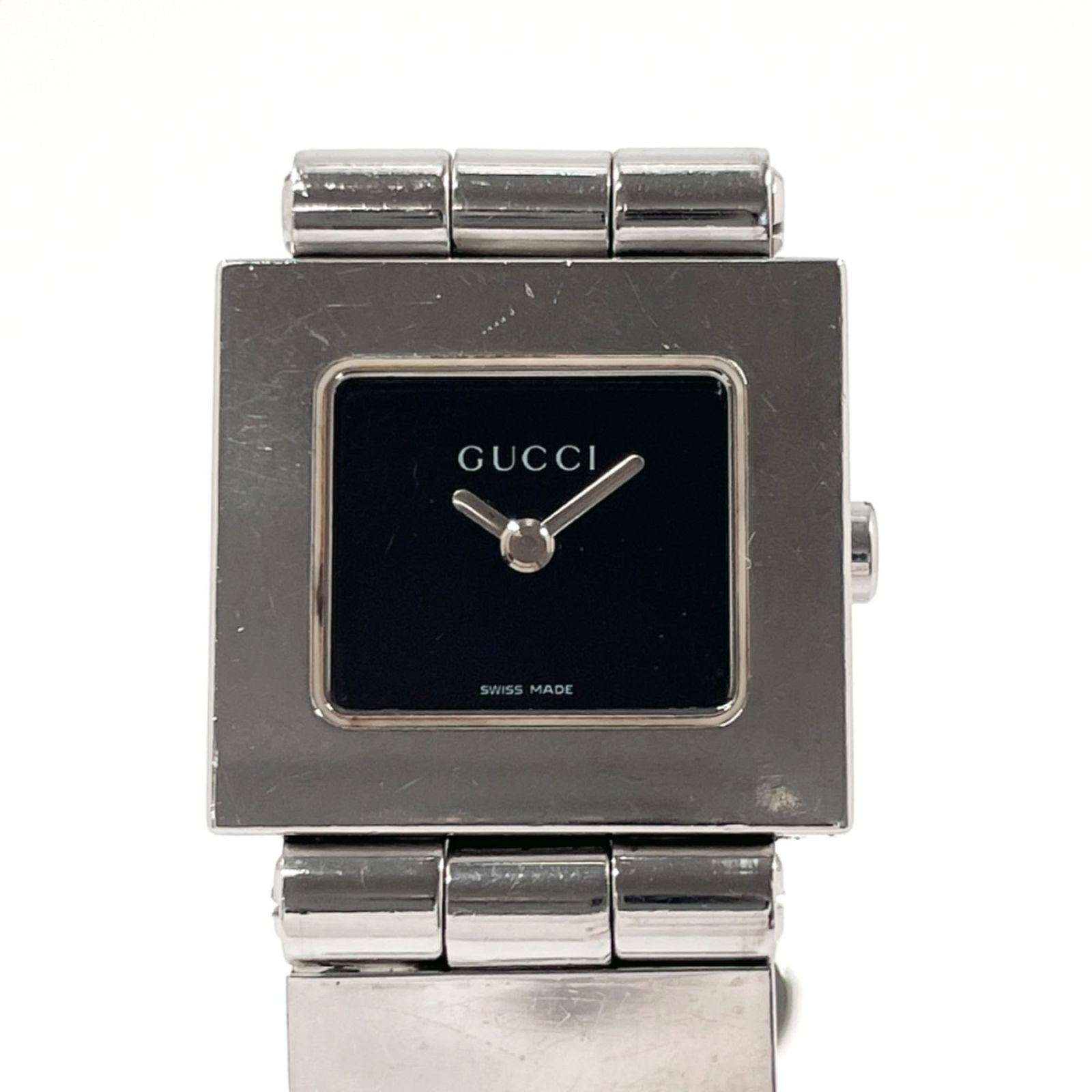 GUCCI 600L Watch: GUCCI 600L Watch The GUCCI 600L wristwatch for women features a stainless steel case and band, a black dial, and a case diameter of 21mm. It is used, with signs of wear, but remains in good condition.