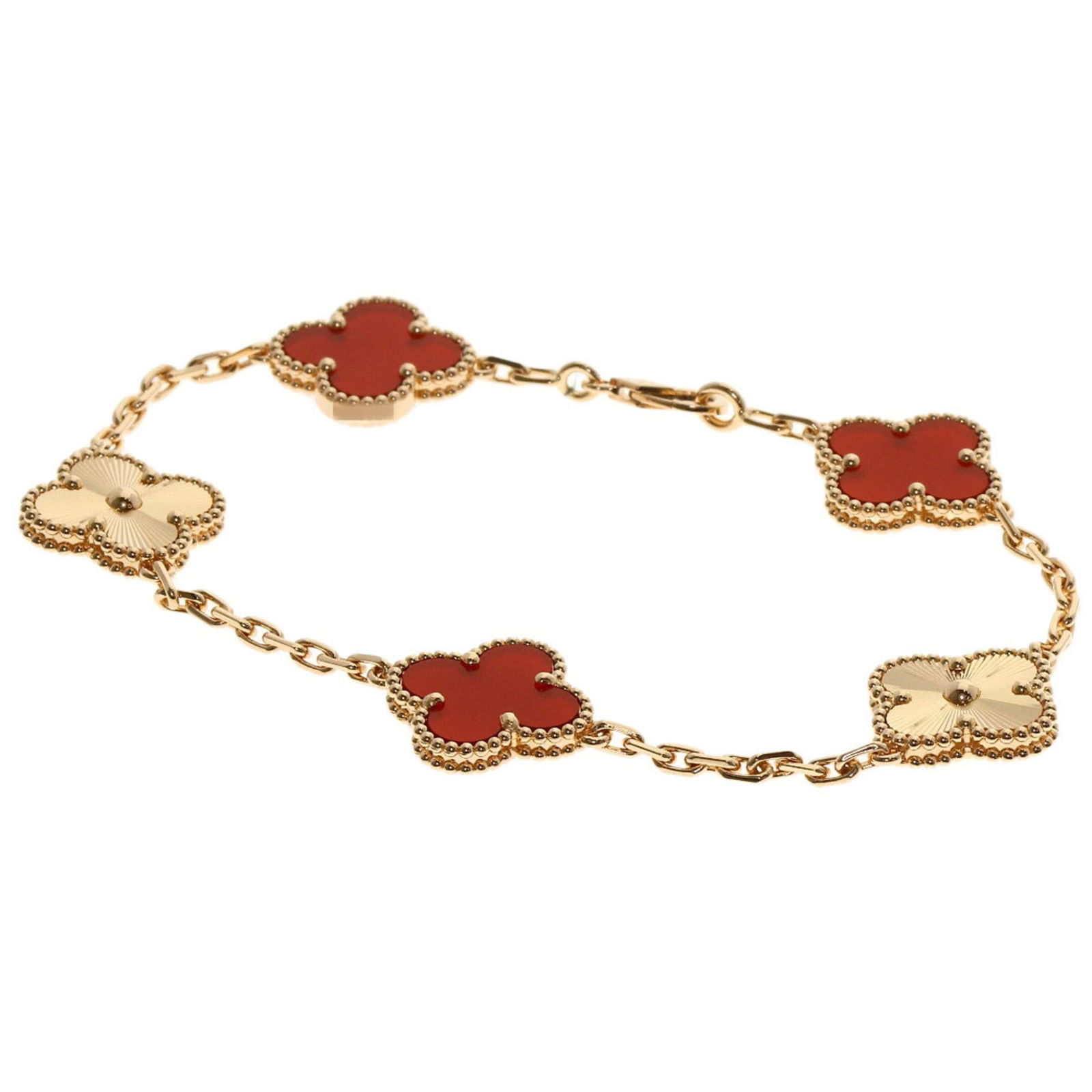 Van Cleef & Arpels Pink Gold Charm Bracelet: Van Cleef & Arpels Pink Gold Charm Bracelet This charm bracelet by Van Cleef & Arpels is made of 18K pink gold and features a carnelian stone, measuring 17.5 cm in length. It is in very good condition