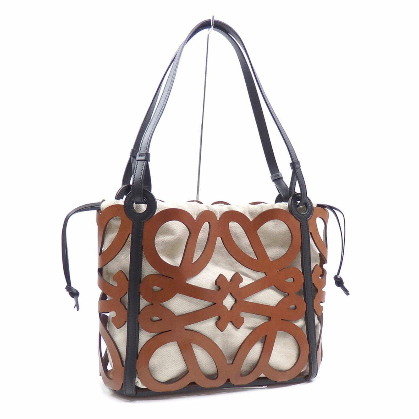 Leather Loewe Tote Bag: Leather Loewe Tote Bag Loewe tote bag in black and brown leather, measuring 28 x 31.5 x 11 cm, in good used condition with some wear. Item Specifics: Brand: Loewe Type: Tote Bag Material: Leather Colo