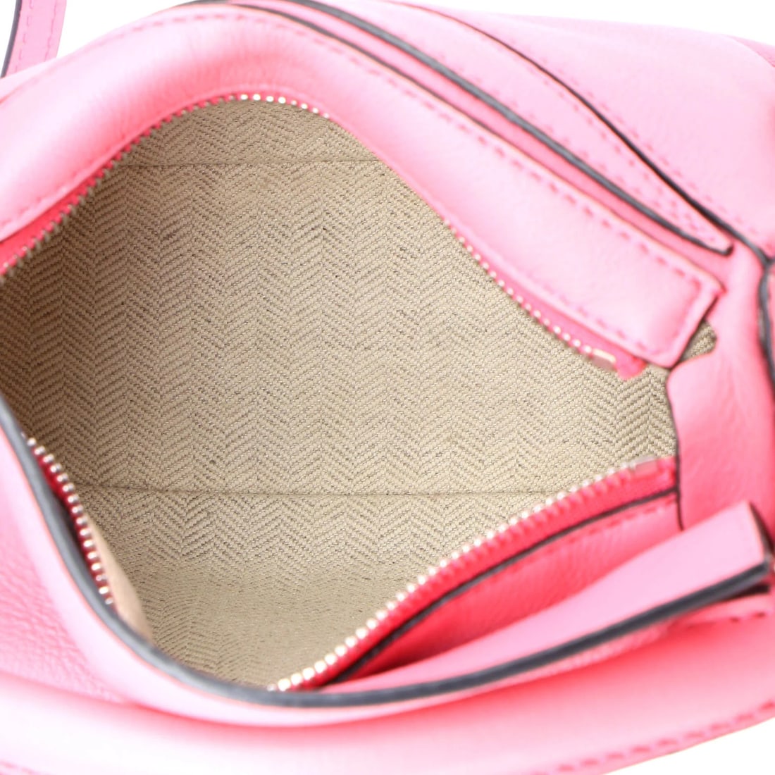 Mini Leather Loewe Puzzle Bag: Mini Leather Loewe Puzzle Bag The Loewe Puzzle Bag in mini size features a pink leather exterior, with measurements of 4.5 inches in height and 6.5 inches in width, showing minor signs of wear. Item S