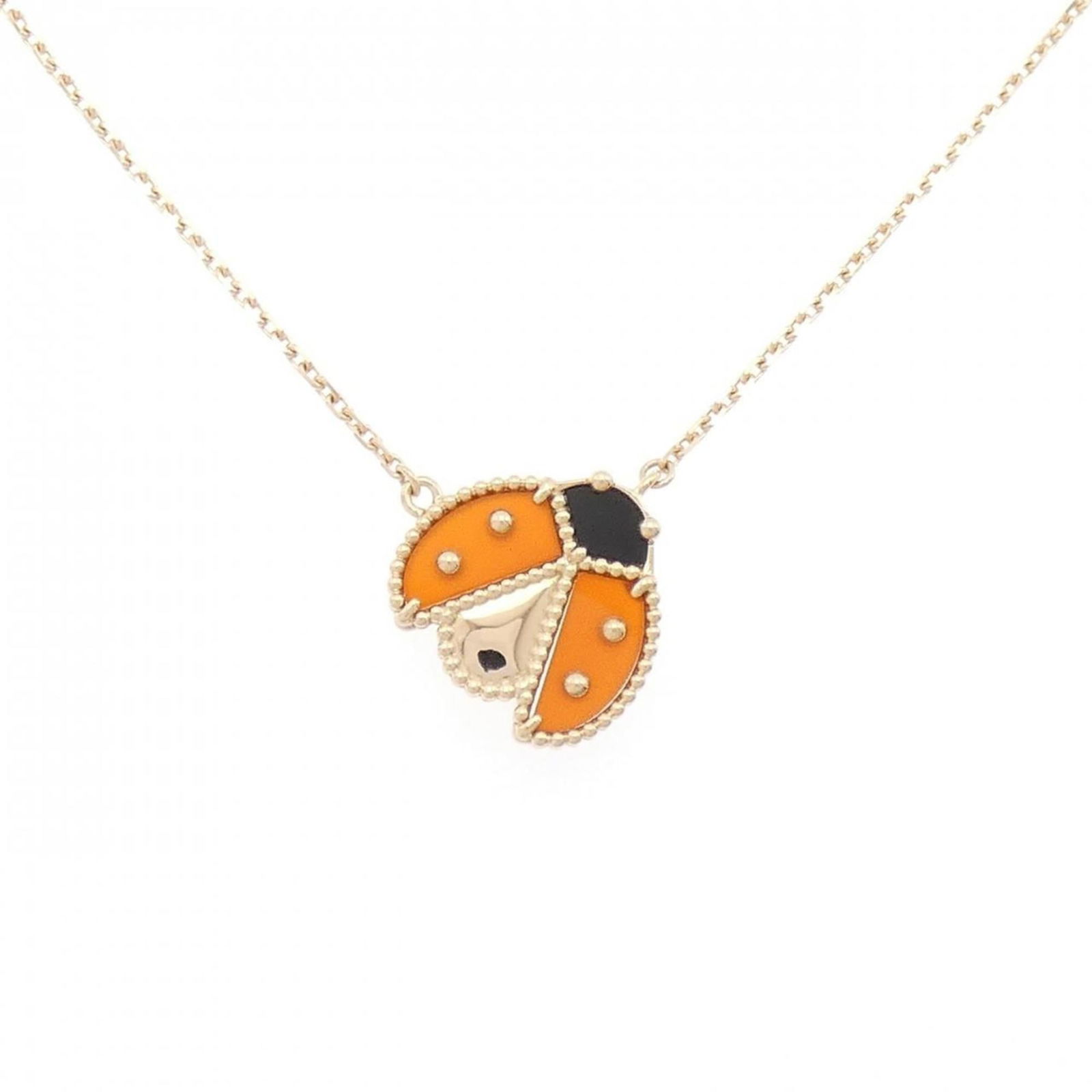 Gold Van Cleef & Arpels Pink: Gold Van Cleef & Arpels Pink This Van Cleef & Arpels necklace features an 18K pink gold pendant with carnelian and onyx stones, sized 15.7mm x 15.5mm, fitting neck circumferences of 38cm to 42cm, and