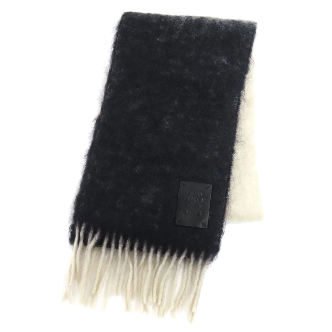 LOEWE Moheya Wool Anagram Scarf: LOEWE Moheya Wool Anagram Scarf LOEWE's Moheya Wool Anagram Scarf is styled in black and white, ideal for versatile wear. Item Specifics: Brand: LOEWE Style: Scarf Material: Moheya Color: Black x whit