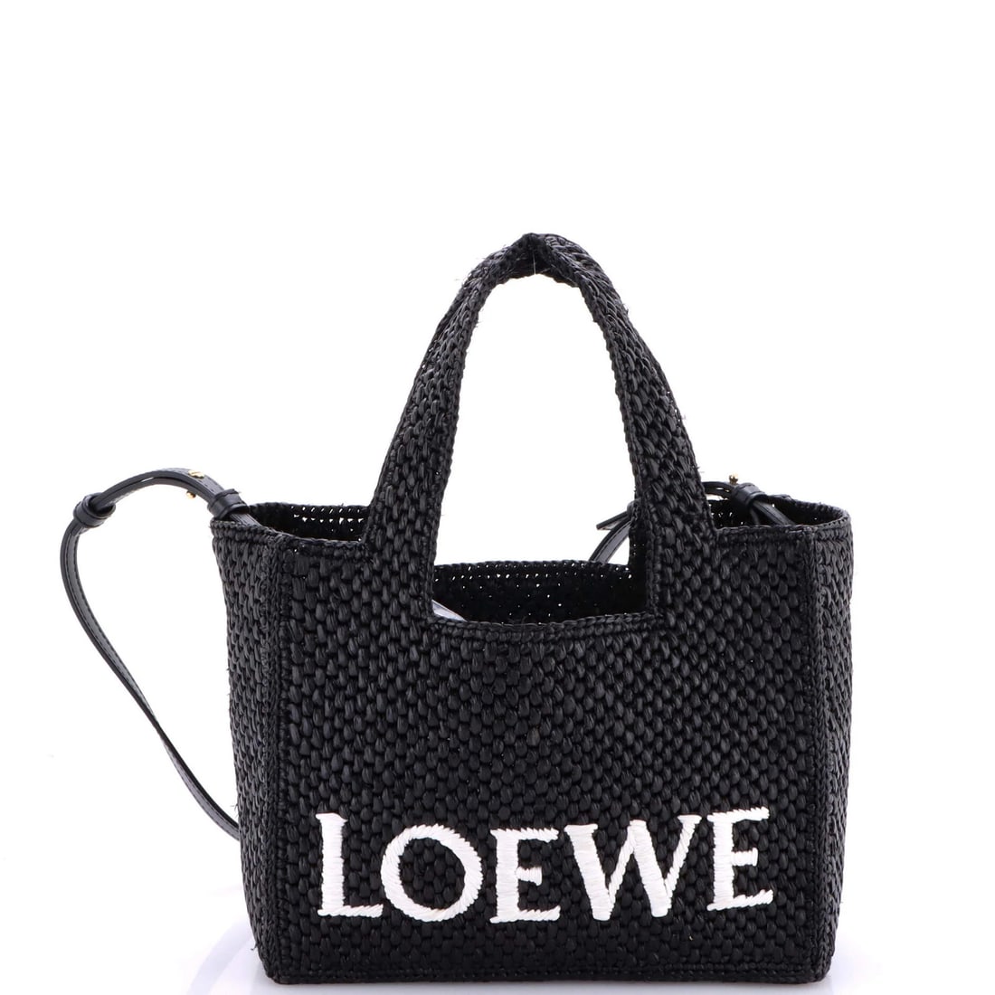 Loewe Paula's Ibiza Small Logo Convertible Tote in Raffia: Loewe Paula's Ibiza Small Logo Convertible Tote in Raffia Loewe Paula's Ibiza Small Logo Convertible Tote made of black and white raffia, measuring 7.5" H x 9" W x 4" D. Condition is very good with mi