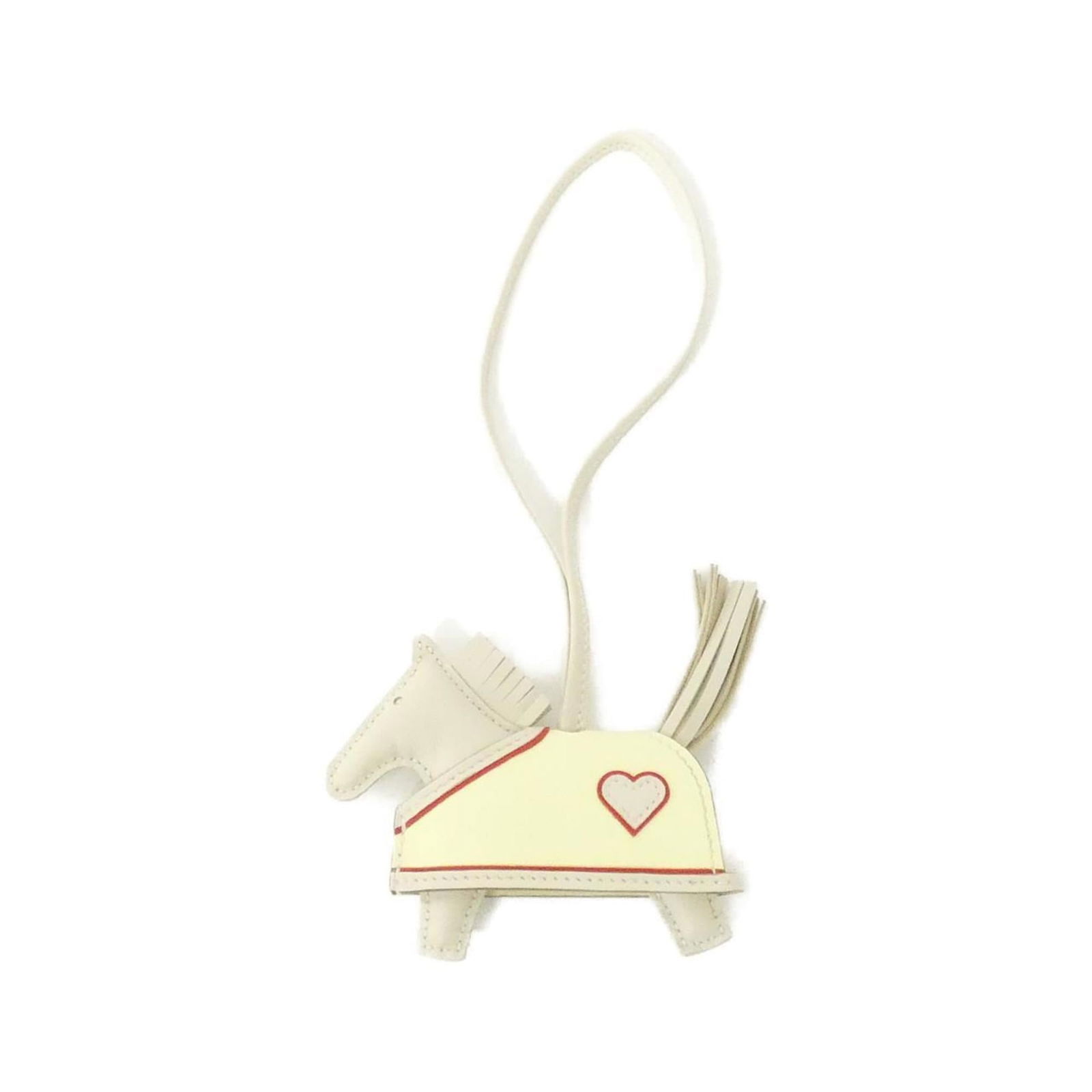 Hermes Agneau Milo Handbag Charm: Hermes Agneau Milo Handbag Charm Hermes Agneau Milo Handbag Charm made from swift leather in white, measuring 70mm x 80mm, in very good used condition with minor traces of usage. Item Specifics: