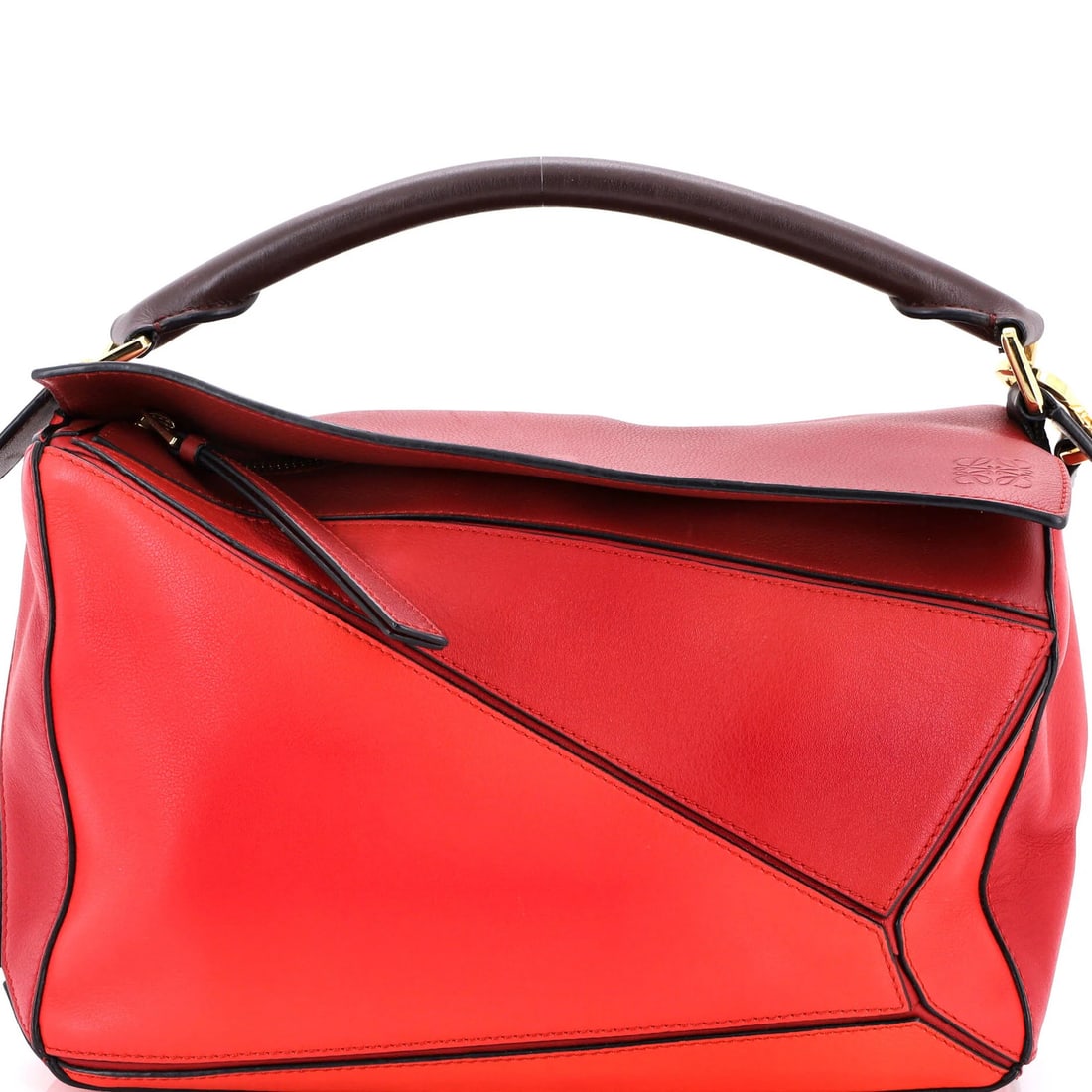 Medium Loewe Puzzle Bag Leather: Medium Loewe Puzzle Bag Leather The Medium Loewe Puzzle Bag in red leather measures 7" H x 11" W x 5.5" D and features a black fabric interior, with some scuffs and minor corner wear. Item Specifics: