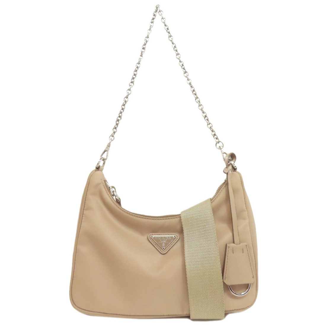 Re-Edition 2005 Handbag Nylon with Logo Hardware by PRADA: Re-Edition 2005 Handbag Nylon with Logo Hardware by PRADA This beige nylon handbag from PRADA, made in Italy, features logo hardware and is designed for everyday use. Item Specifics: Brand: PRADA Styl