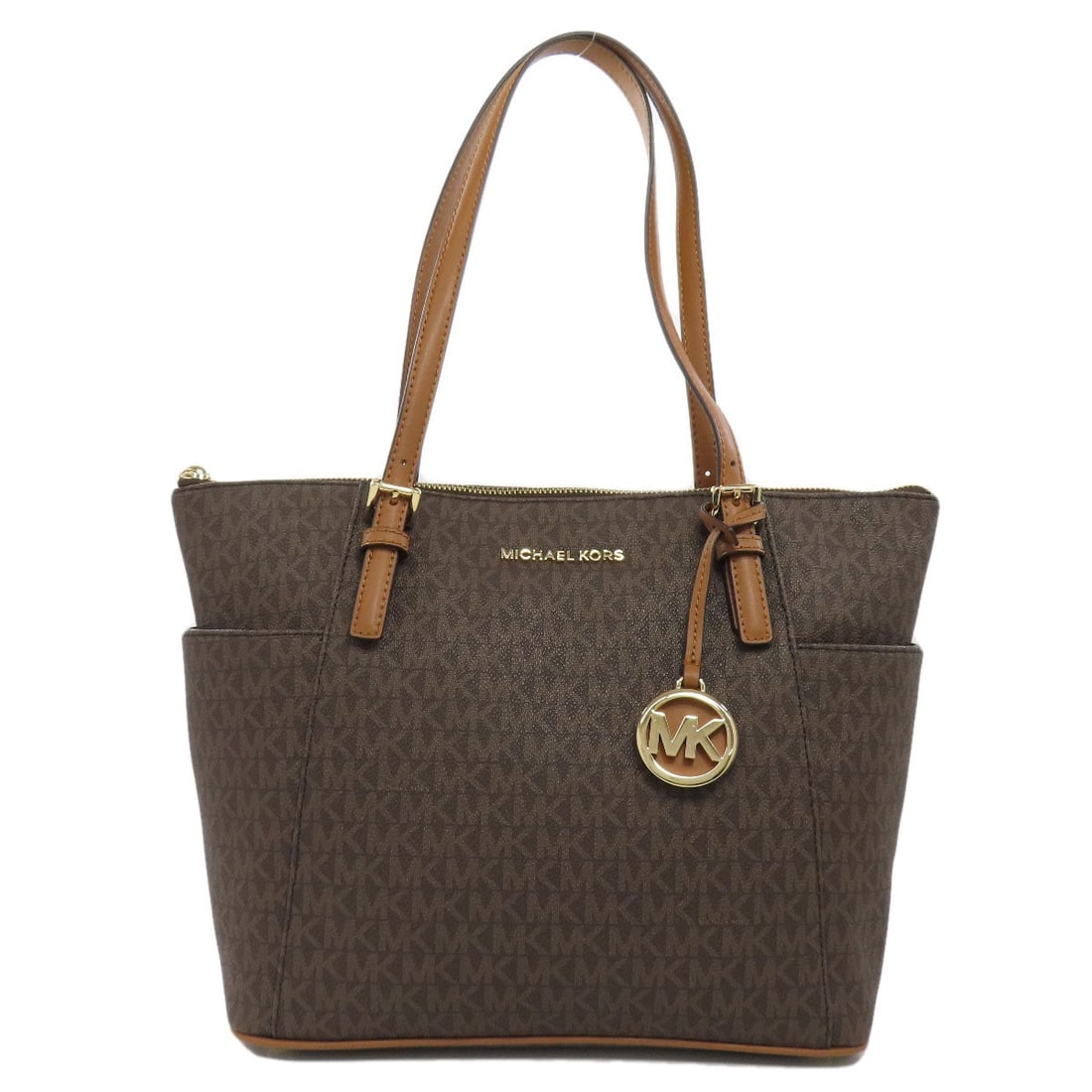 Michael Kors MK Signature Tote Bag PVC: Michael Kors MK Signature Tote Bag PVC Michael Kors tote bag made from brown PVC, offering a stylish and functional accessory. Item Specifics: Brand: Michael Kors Style: Tote Bag Exterior Material: PV