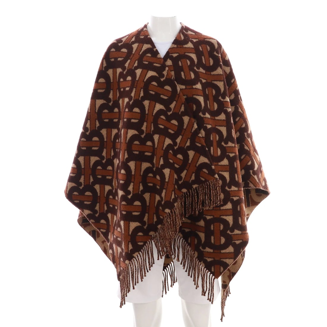 Burberry Women's Wool Blend Reversible Cape TB Monogram: Burberry Women's Wool Blend Reversible Cape TB Monogram This Burberry Women's Reversible Cape TB Monogram is a one-size wool blend apparel in brown, showing very good condition with signs of wear and