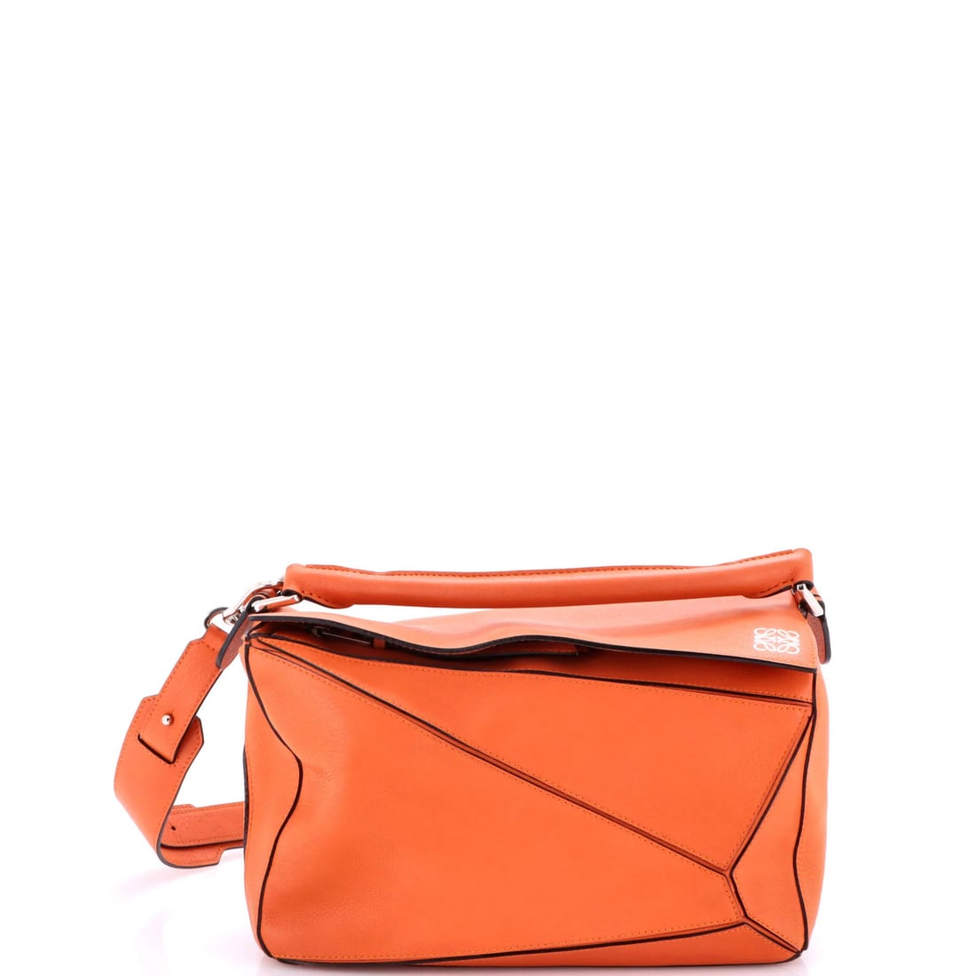 Medium Loewe Puzzle Bag Leather: Medium Loewe Puzzle Bag Leather The Loewe Puzzle Bag in medium size is crafted from orange leather, with a handle drop of 3" and overall dimensions of 8" height and 11" width; it shows very good condi