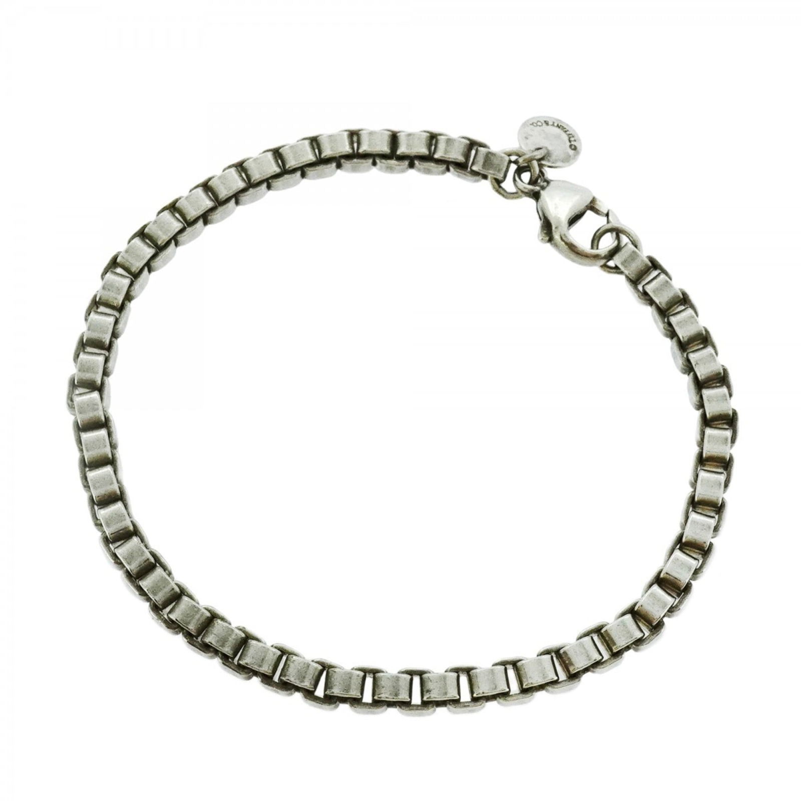 Tiffany Silver 925 Charm Bracelet: Tiffany Silver 925 Charm Bracelet Tiffany & Co. charm bracelet made of silver 925, with a length of 18cm, designed for women. It is in good condition with visible signs of usage. Item Specifics: Brand